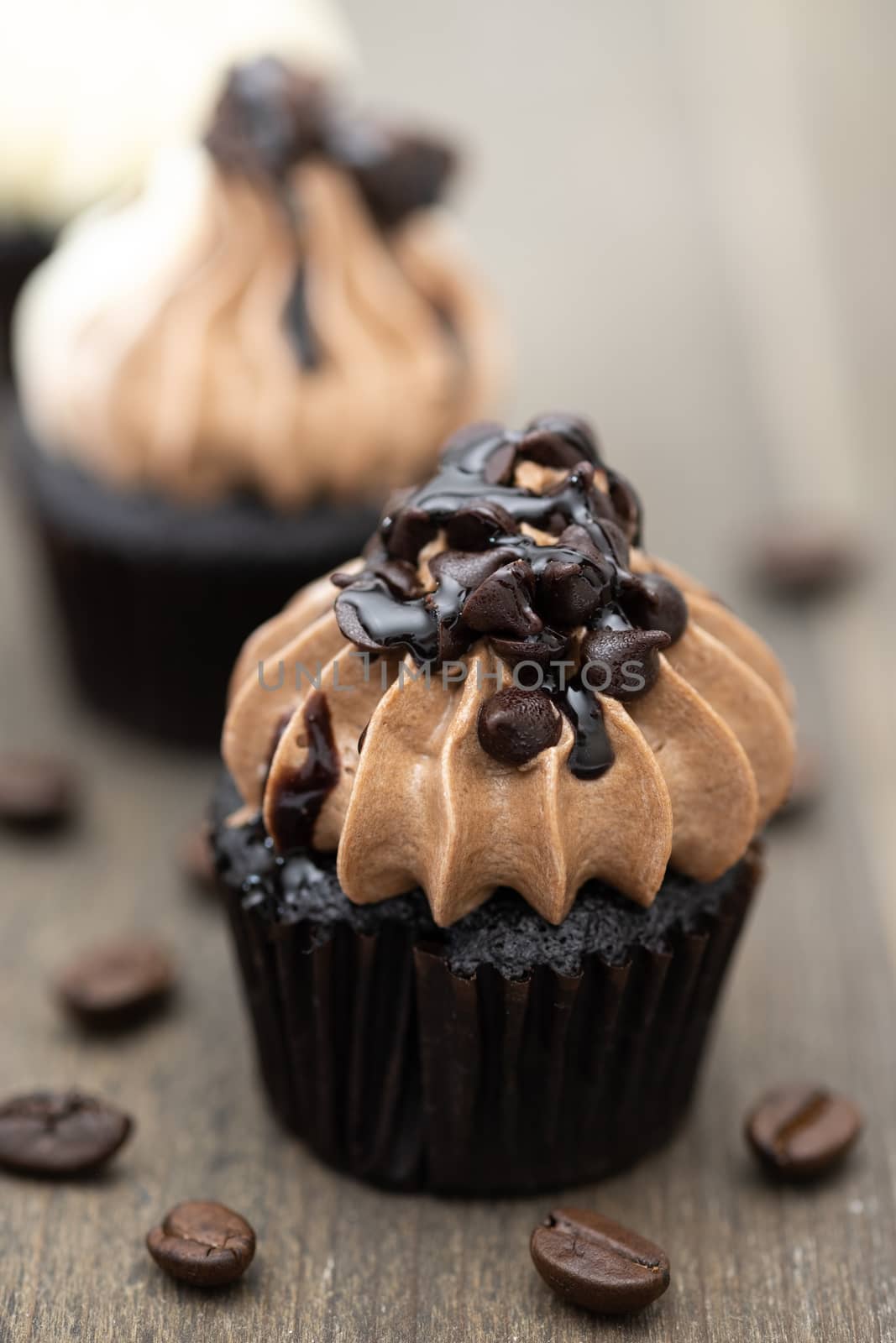 Tasty mini cupcakes on a vintage background, sweet dessert for christmas, new year and valentine holliday.