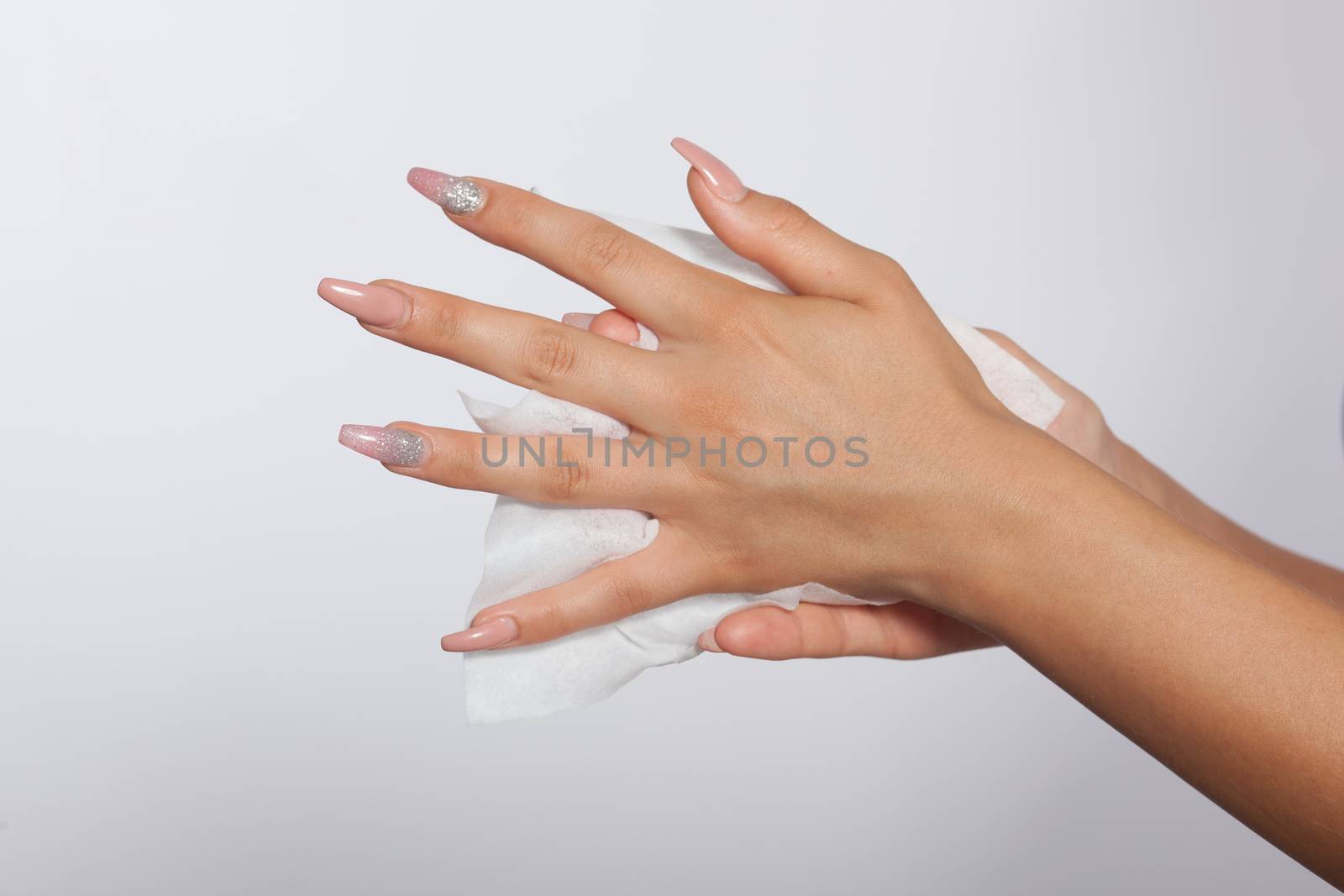 Hand with long nails clean with wet wipes by adamr