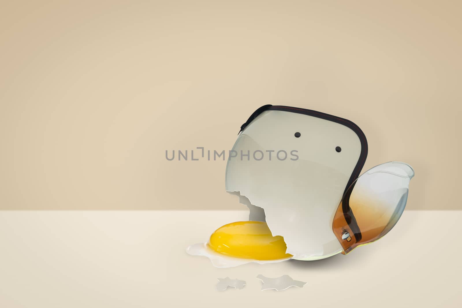 The helmet bumps until it breaks, with the yolk flowing out. Safety concept, minimal style.