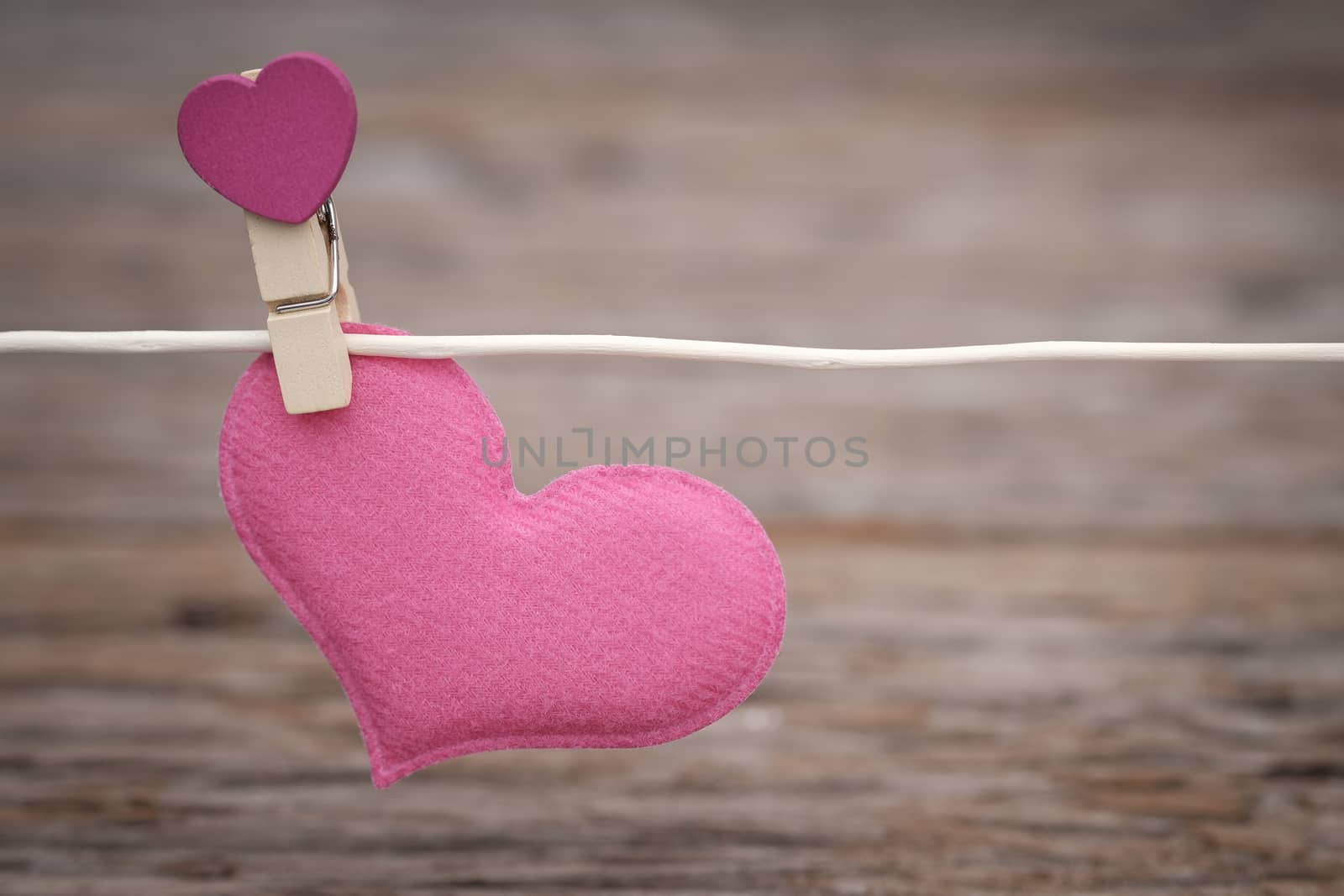 Heart clothespin on the clothesline  with space to write. Valentine concept, Vintage tone, AF point selection.