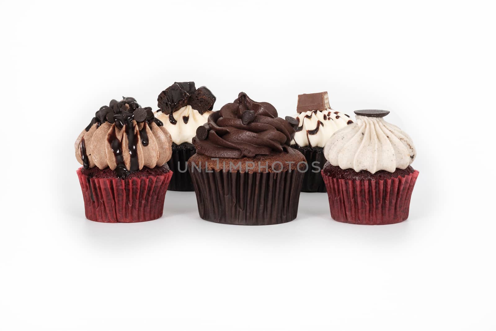Chocolate cupcake with sprinkles isolated on white background.