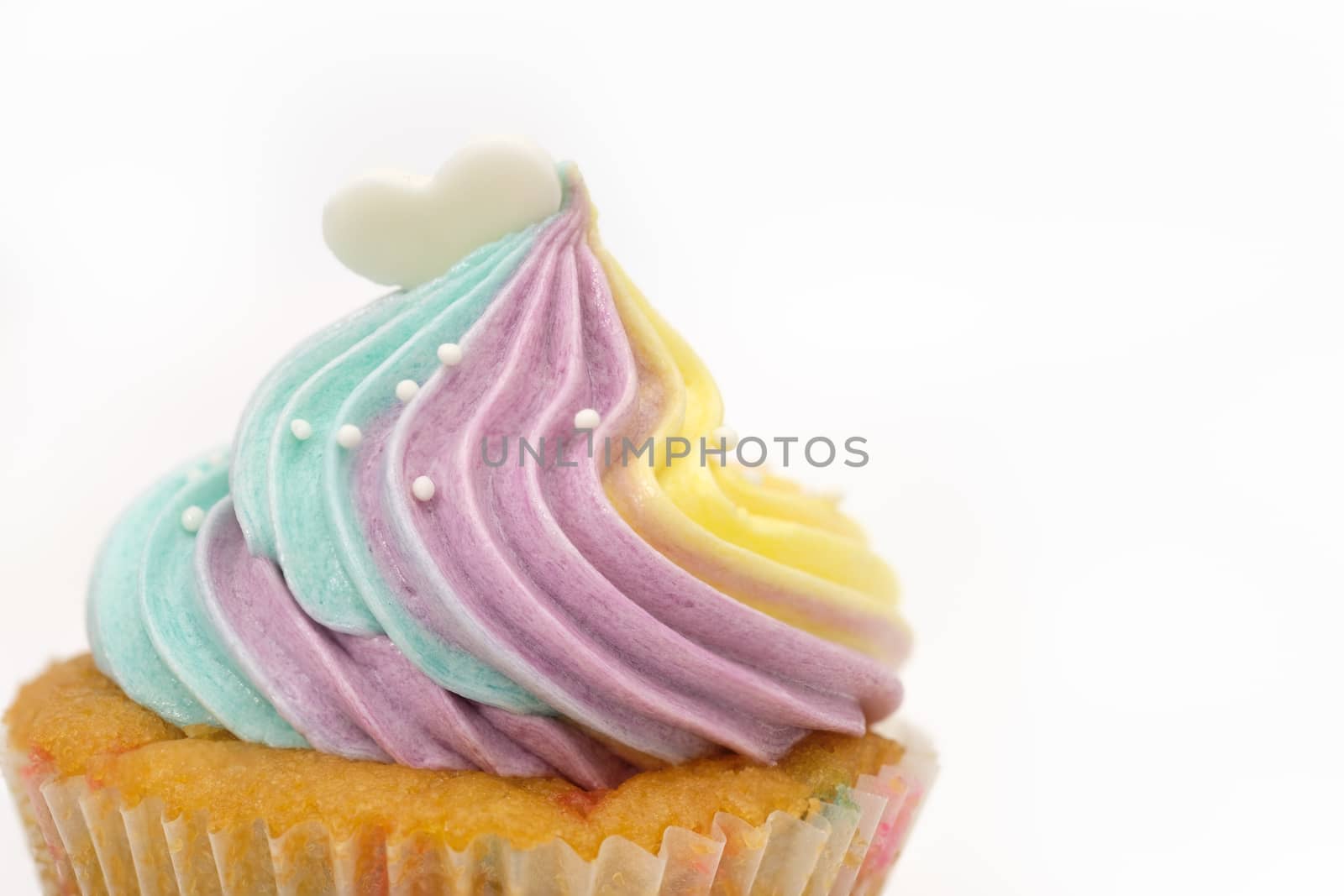 Close-up cupcakes are beautifully decorated isolated on white background.