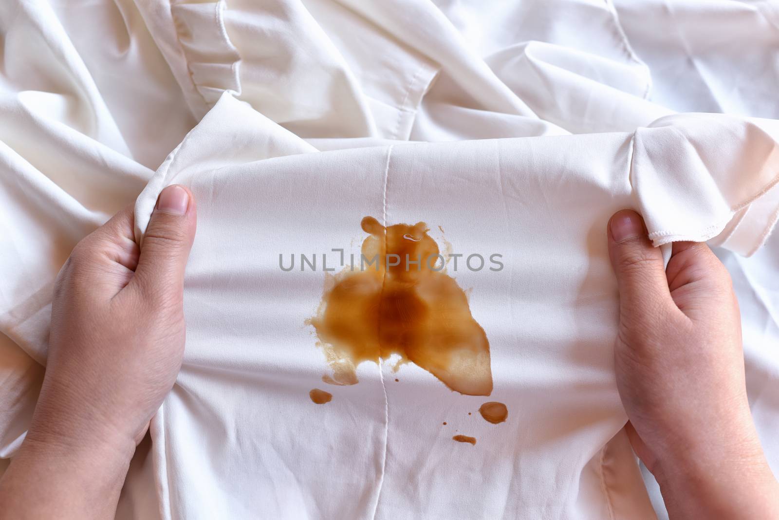 Dirty sauce stain on fabric from accident in daily life. Concept by C_Aphirak