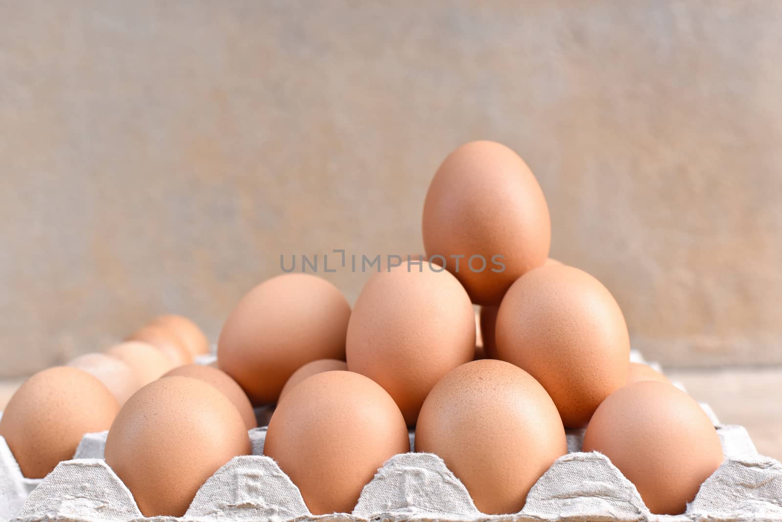 Egg, Chicken Egg. Close-up view of raw Brown chicken eggs in egg by C_Aphirak