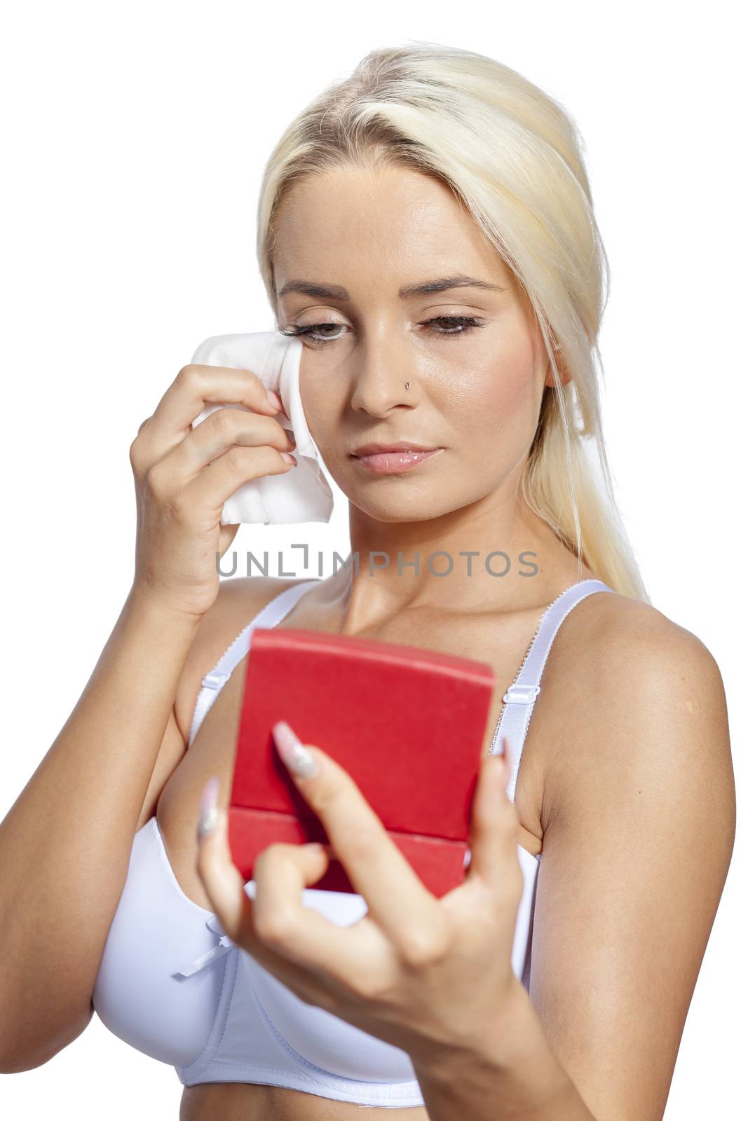 Young woman clean face with wet wipes and holding mirror by adamr