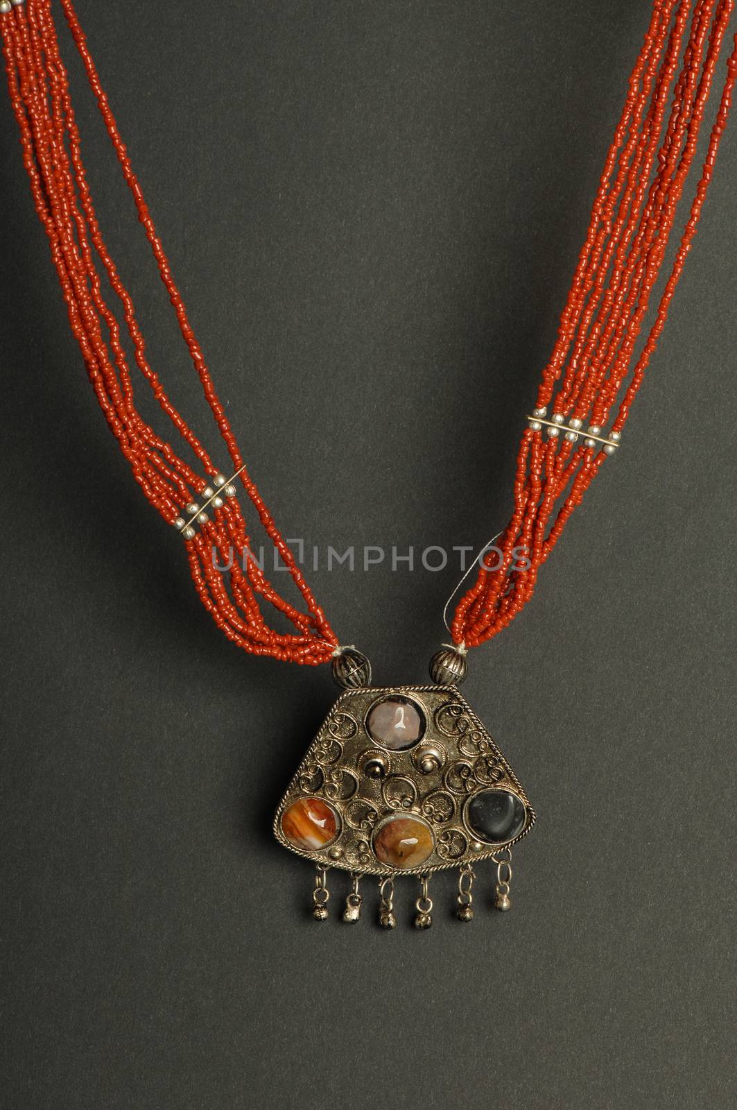 ancient antique pendant with stones on black background. Middle-Asian vintage jewelry