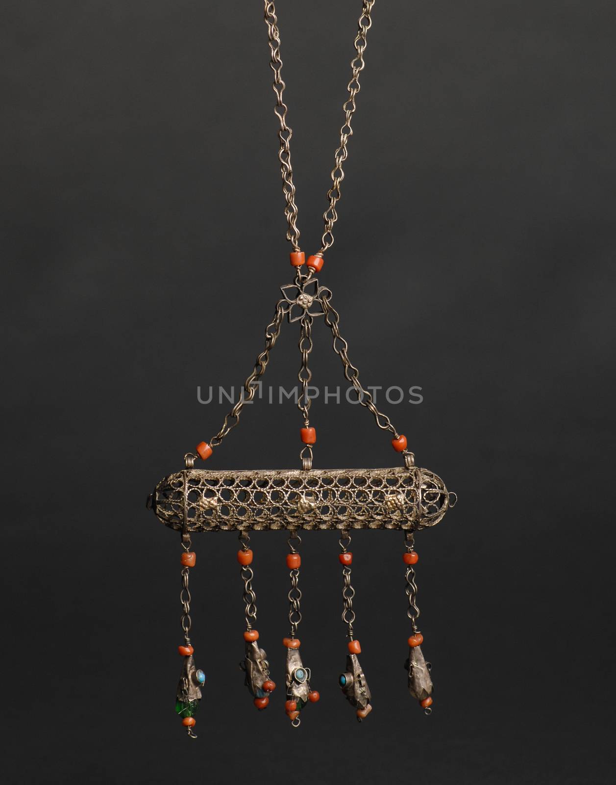 ancient antique pendant with stones on black background. Middle-Asian vintage jewelry