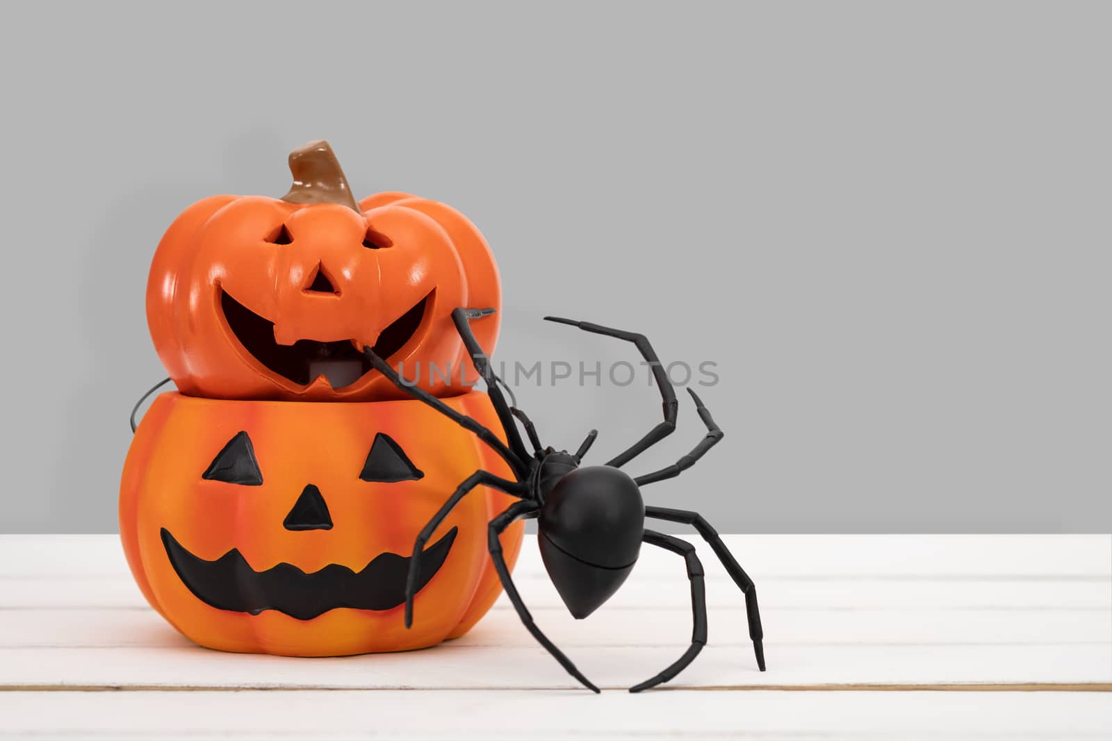 Halloween pumpkin on grey background by feelartfeelant