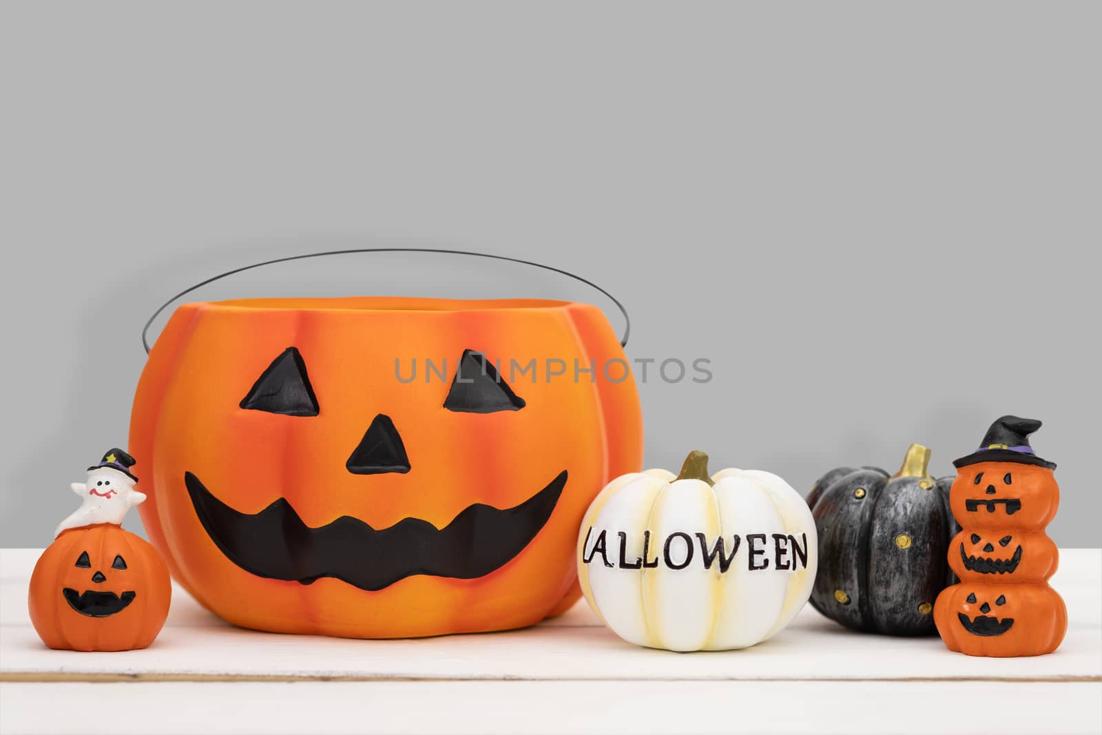 Halloween pumpkin on grey background by feelartfeelant