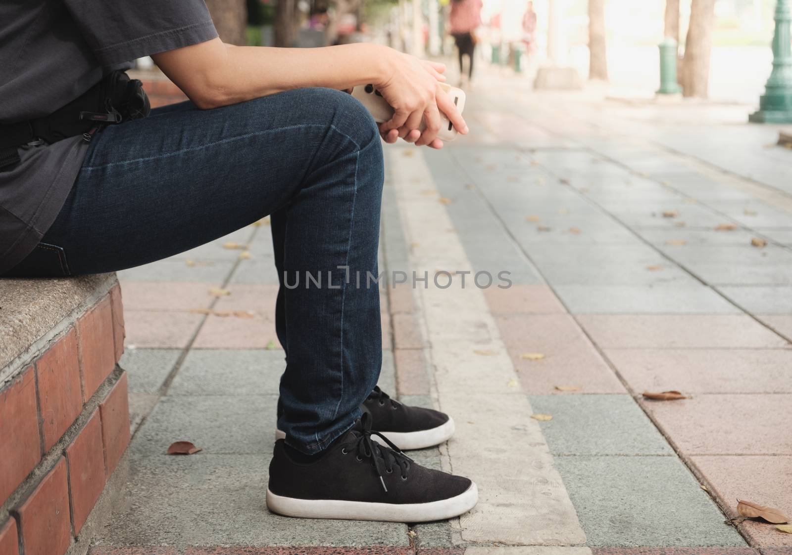 One man is waiting for a bus with copy space.