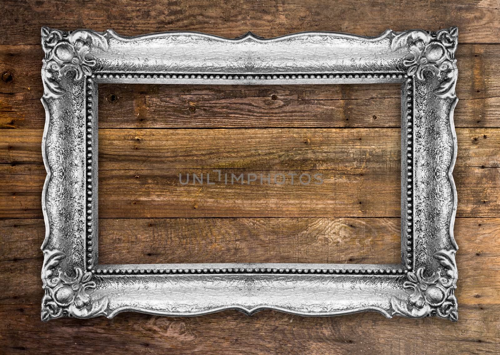 Retro Silver Gold Picture Frame on wooden wall by adamr