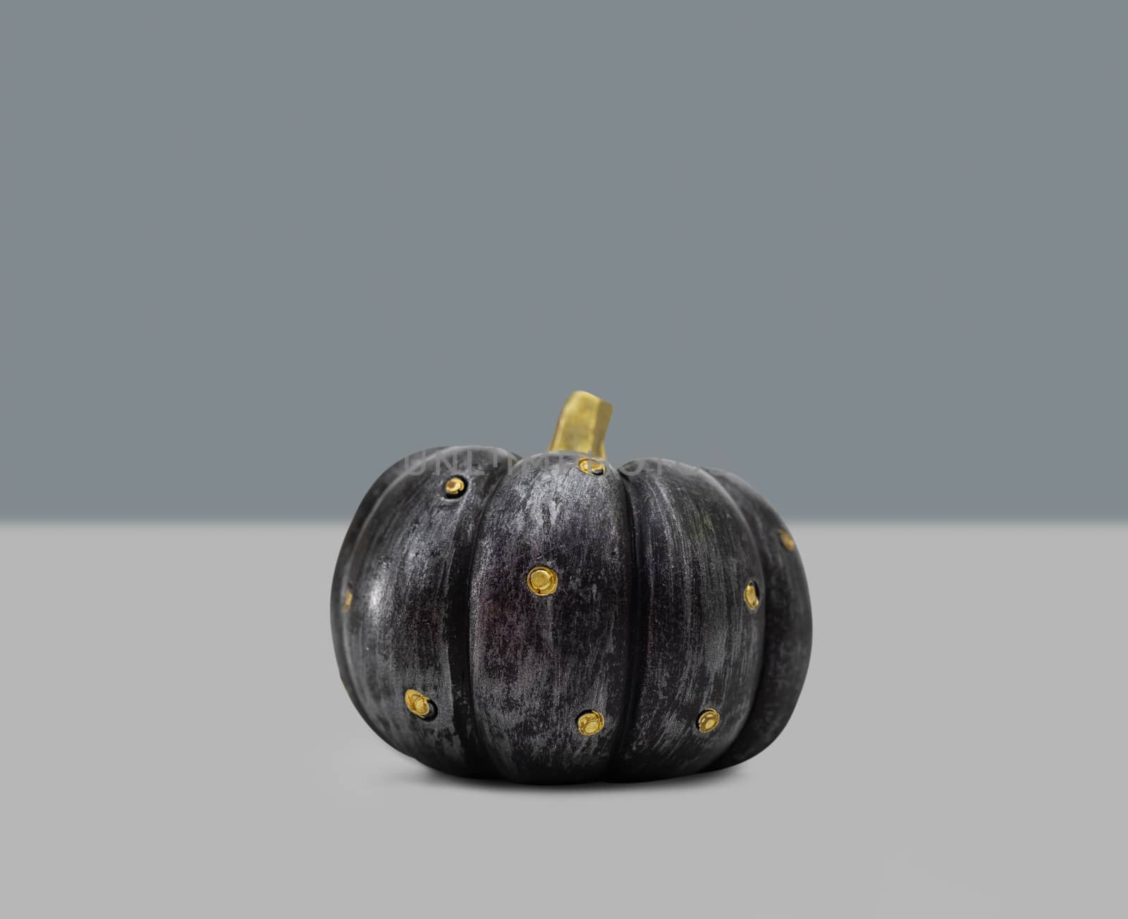 Halloween pumpkin on grey background by feelartfeelant
