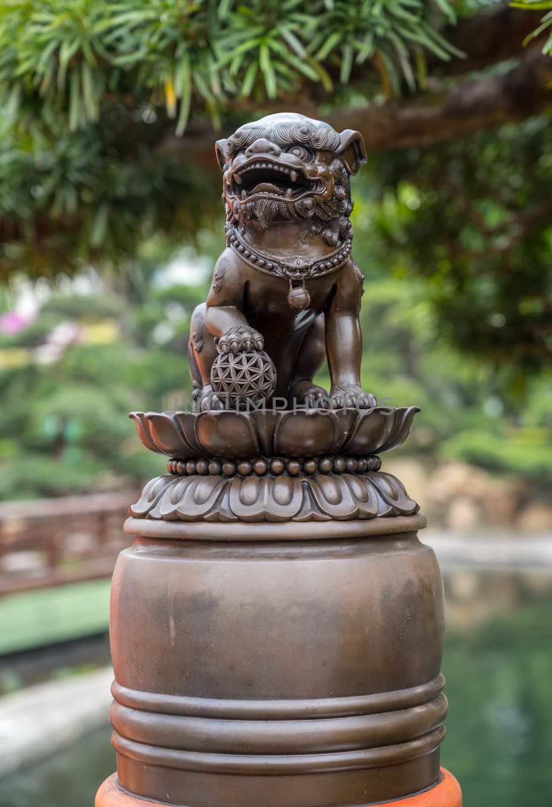 Lion wiht paw on globe in Chi Lin Nunnery by steheap