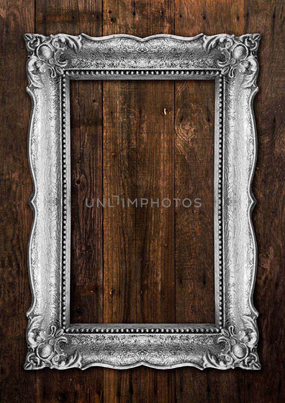 Old Silver Picture Frame on wood baclground