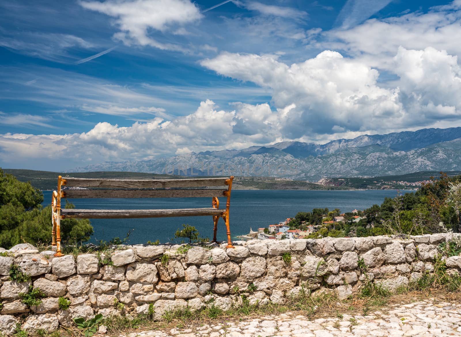 Bench on top of ruins of old Venetian fort above the coastal town of Novigrad in Croatia