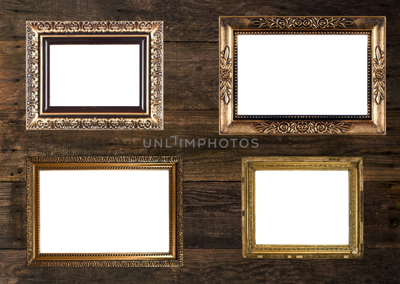 Group of Old Gold Picture Frames on wooden wall