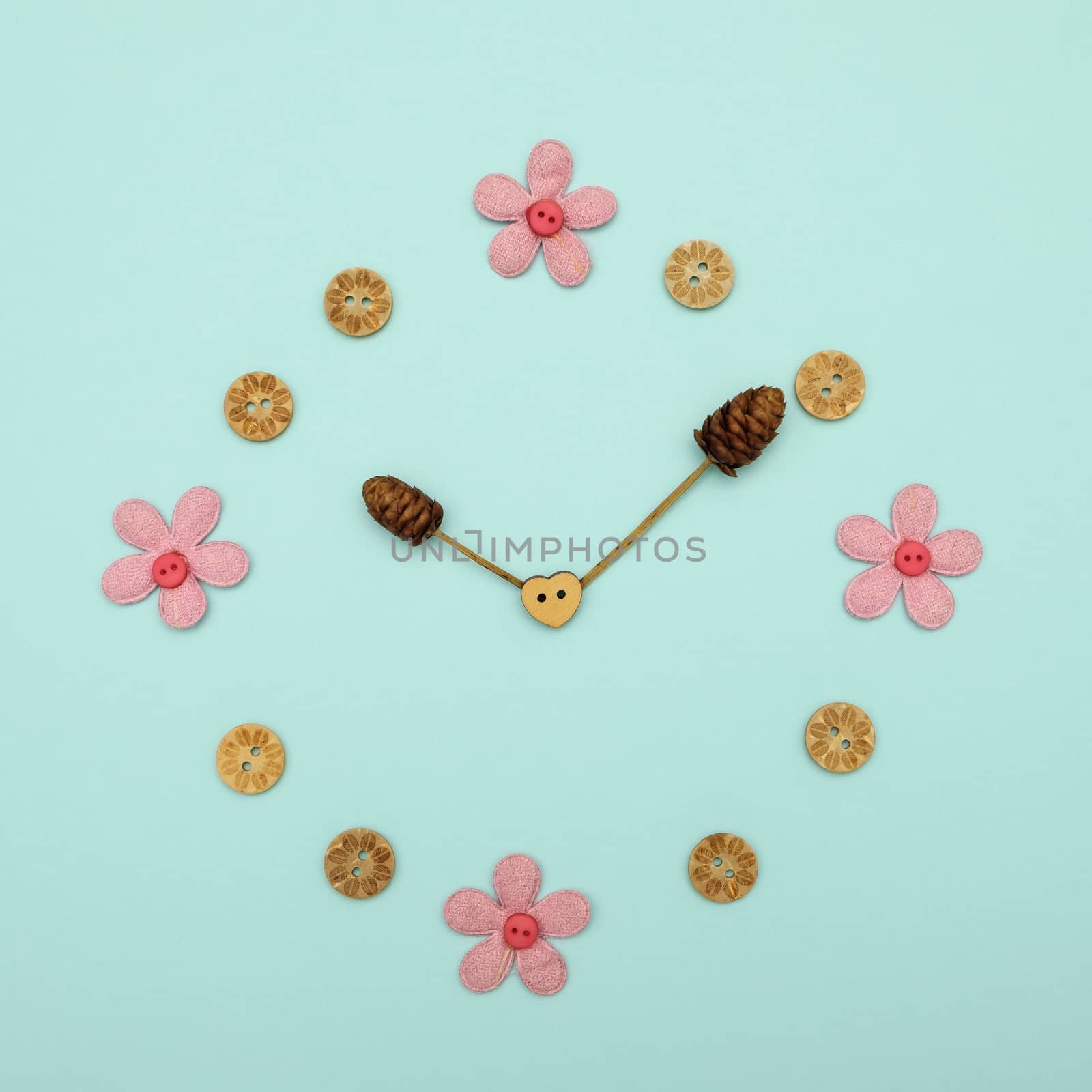 Clock made of flowers at 10.00 on blue background, The concept of time.