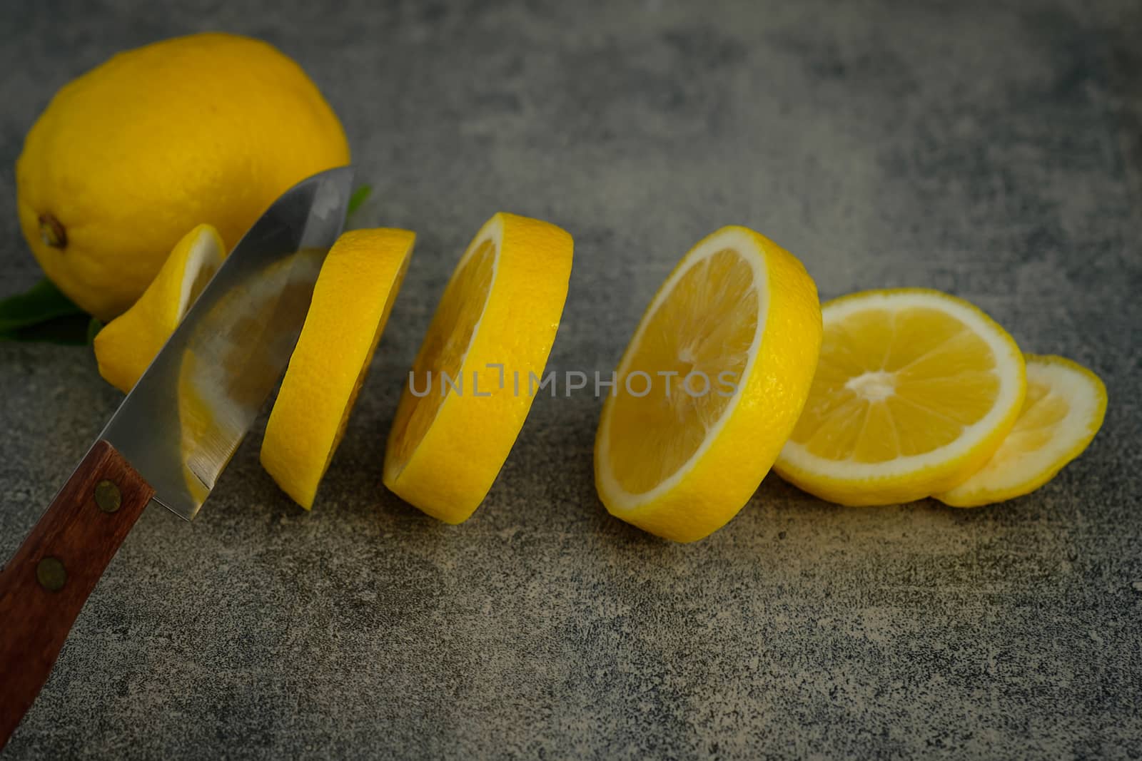 Still life with lemons on rustic low key background, Choose focal point, dark light style.