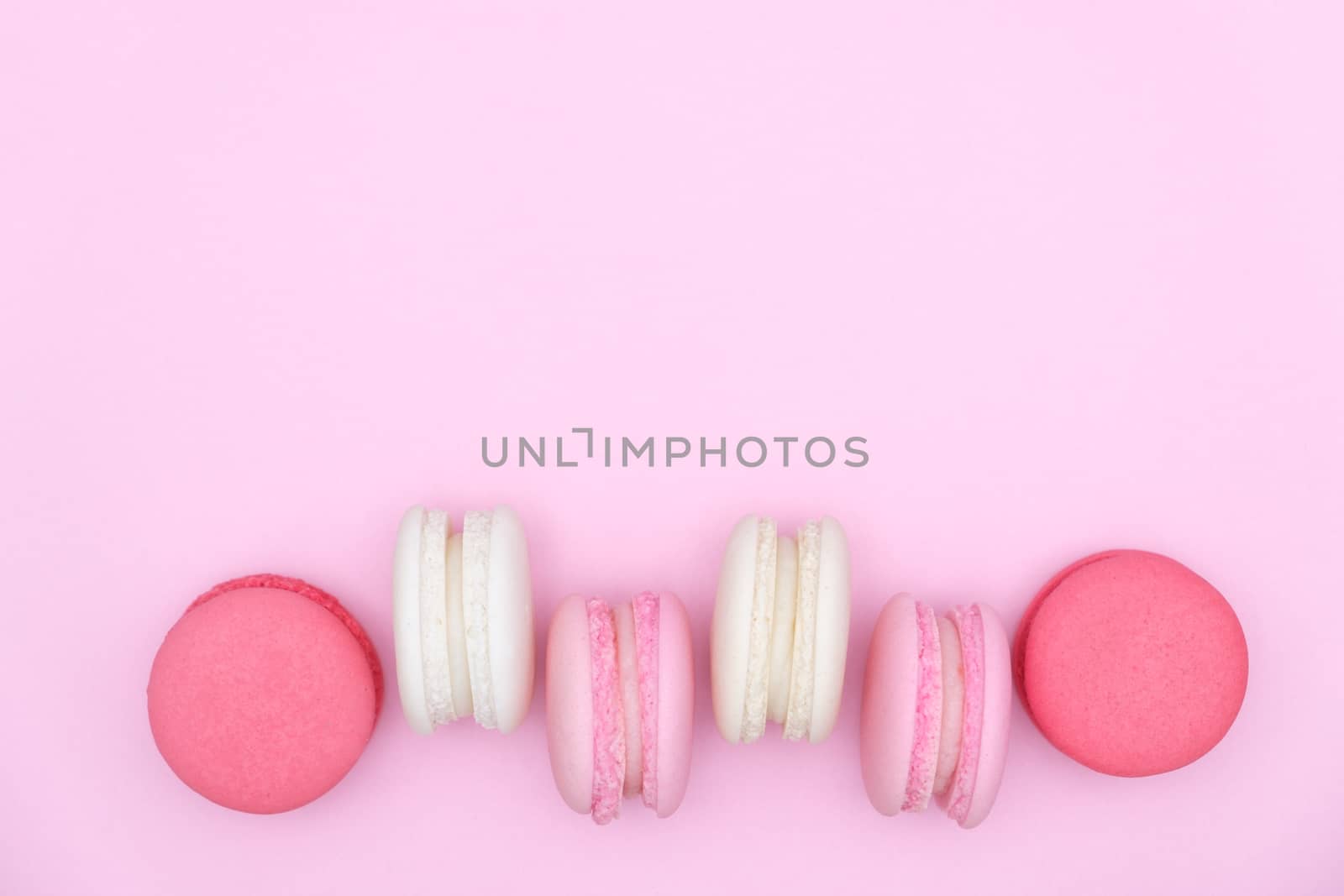 macarons on pink background, Beautiful dessert, Flat lay style with copy space to write.