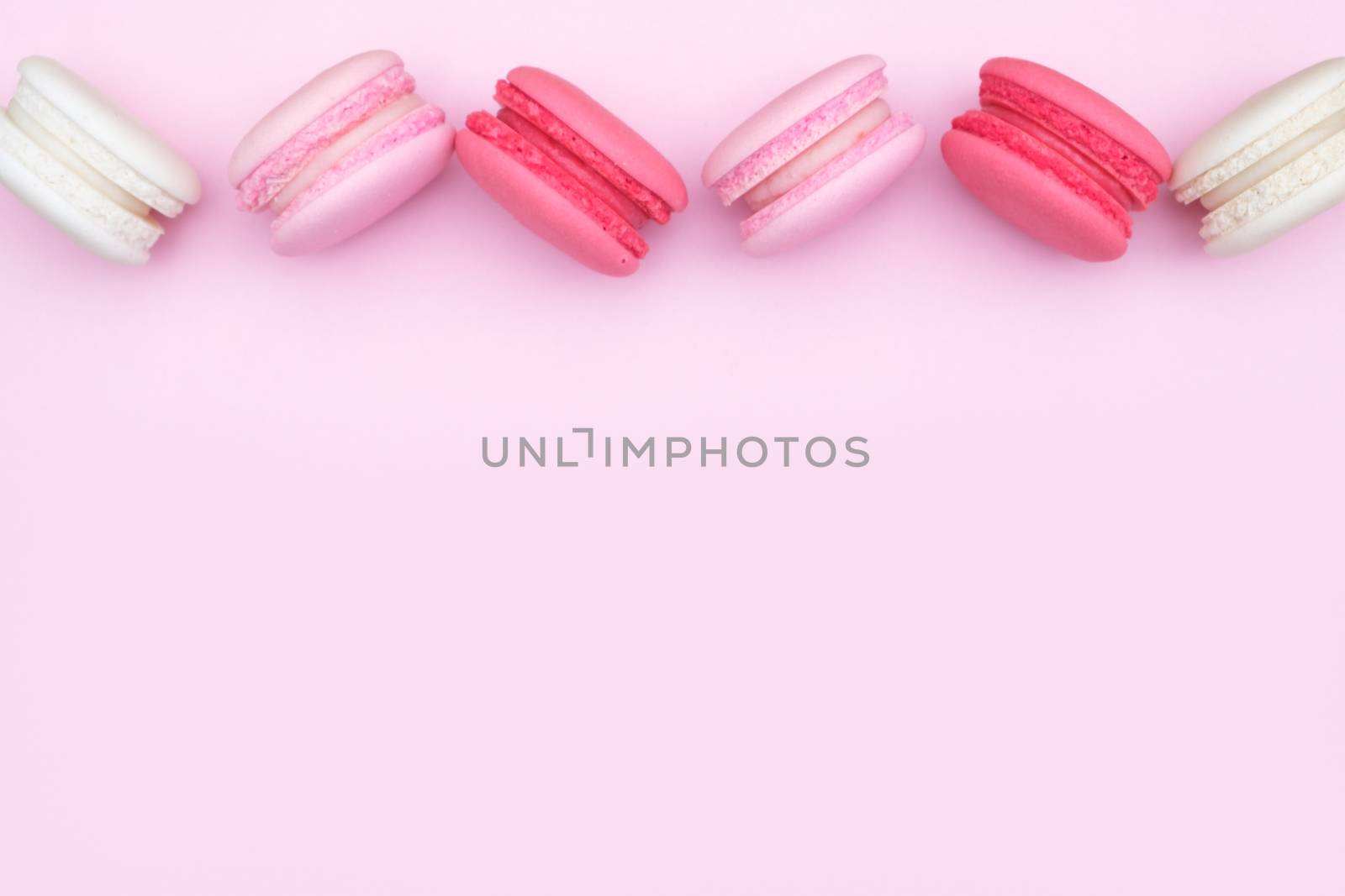 macarons on pink background, Beautiful dessert, Flat lay style with copy space to write.