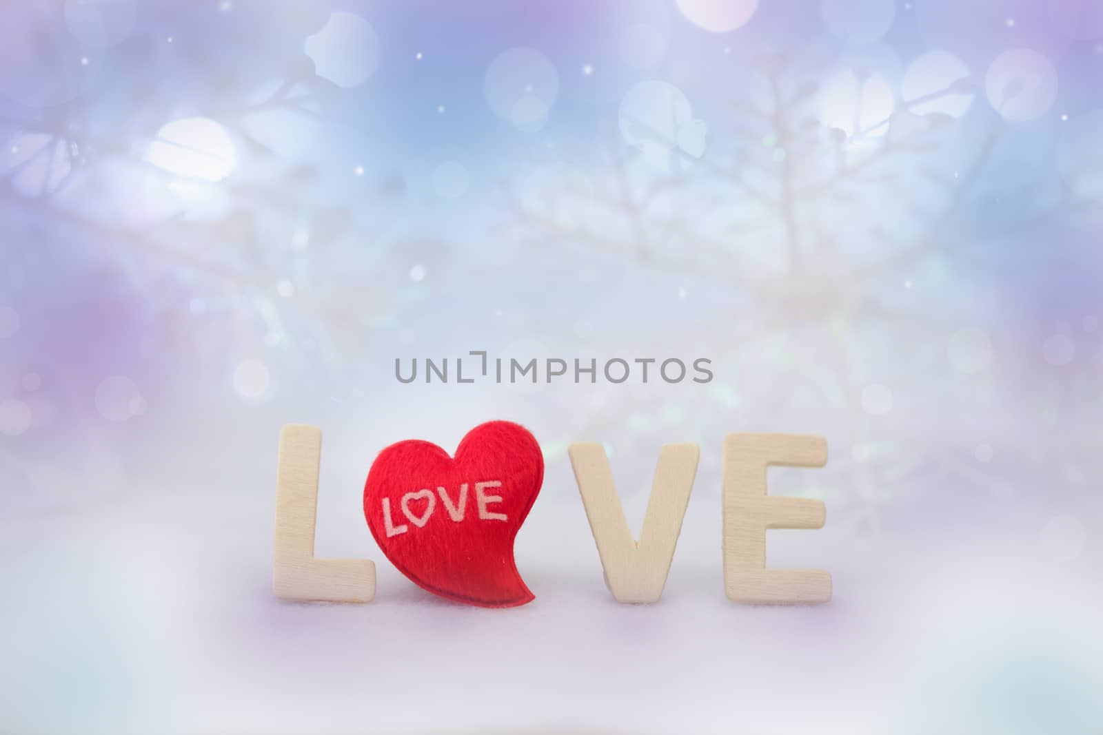 The red Heart shapes and love word on abstract bokeh background in love concept for valentines day with romantic moment.