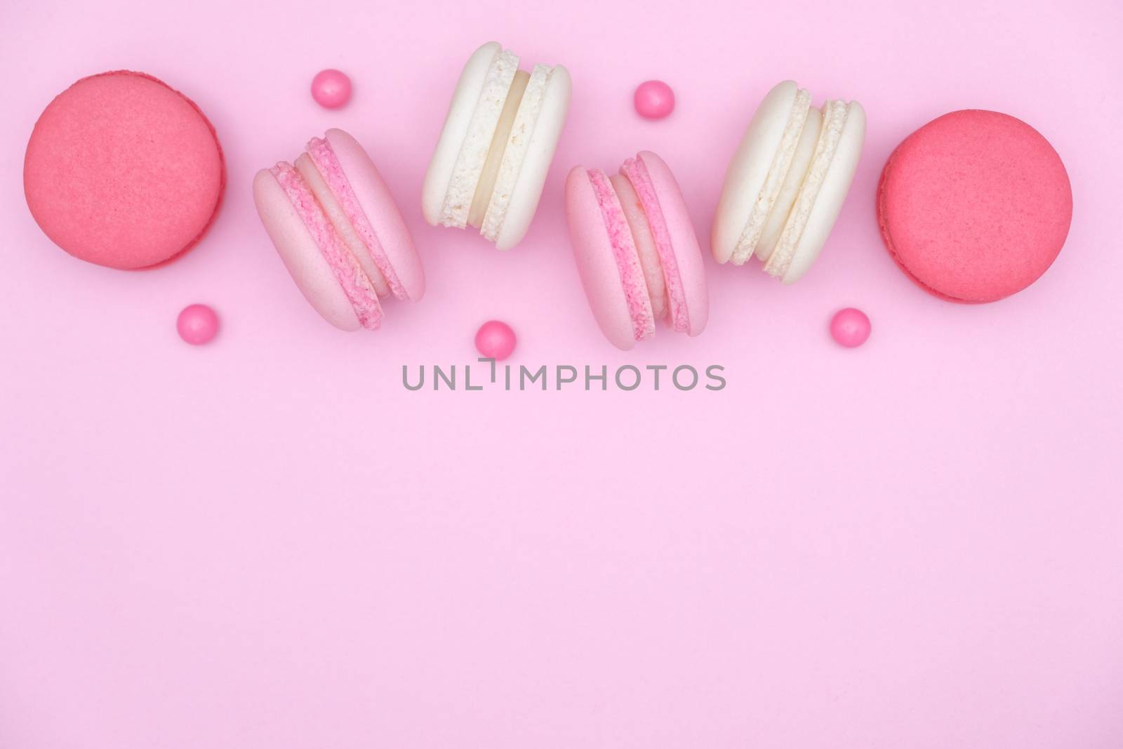 macarons on pink background, Beautiful dessert, Flat lay style with copy space to write.