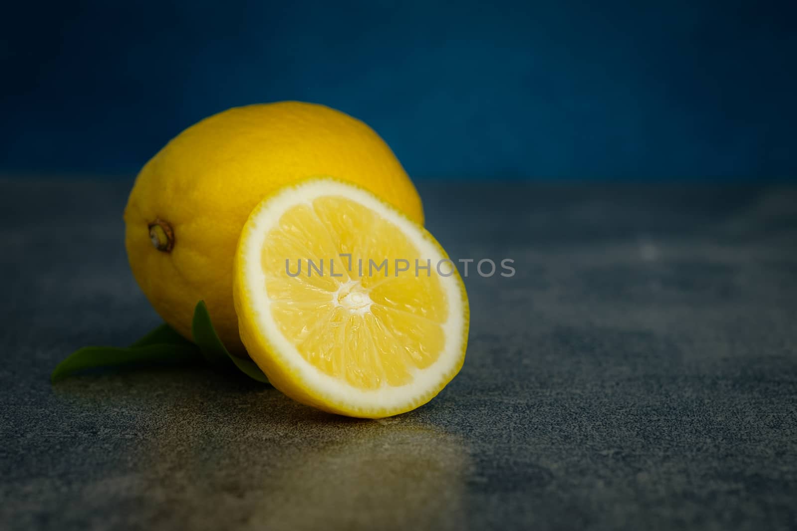 Still life with lemons on rustic low key background, Choose focal point, dark light style.