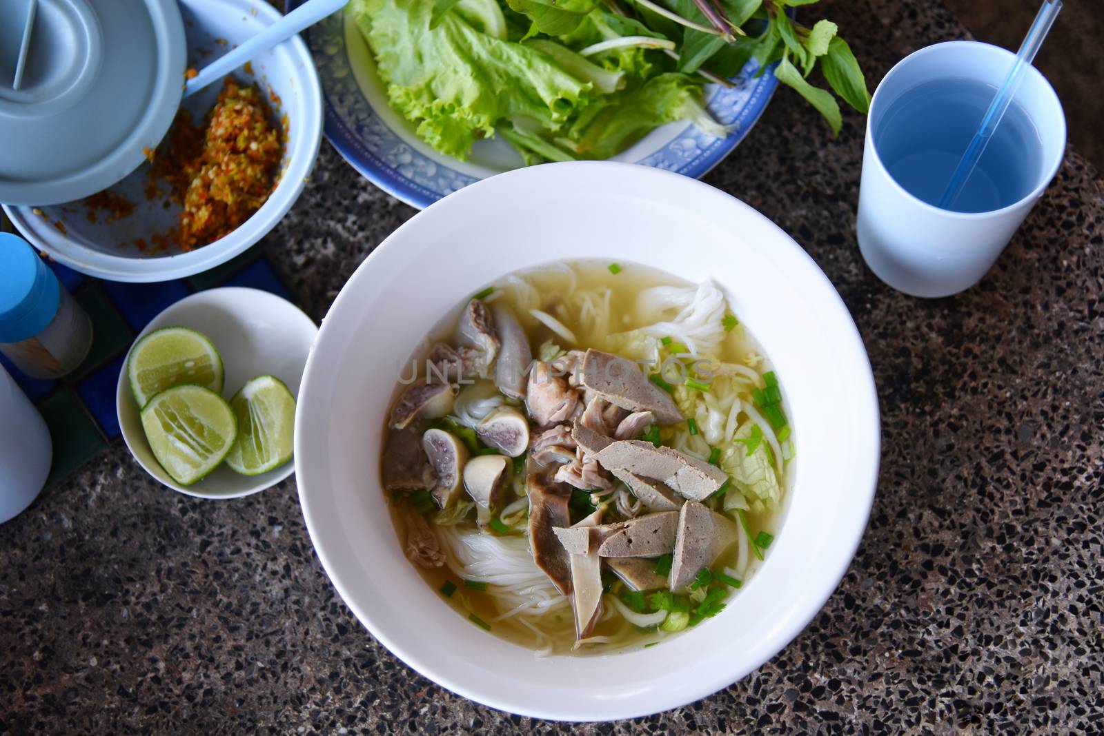 Top view Khanom Chin Nam Ngeaw, Rice noodles or Thai North East local noodle made from fermented rice flour with pork soup. Delicious local food for sell at Chiang Khan Thailand only. Selected focus