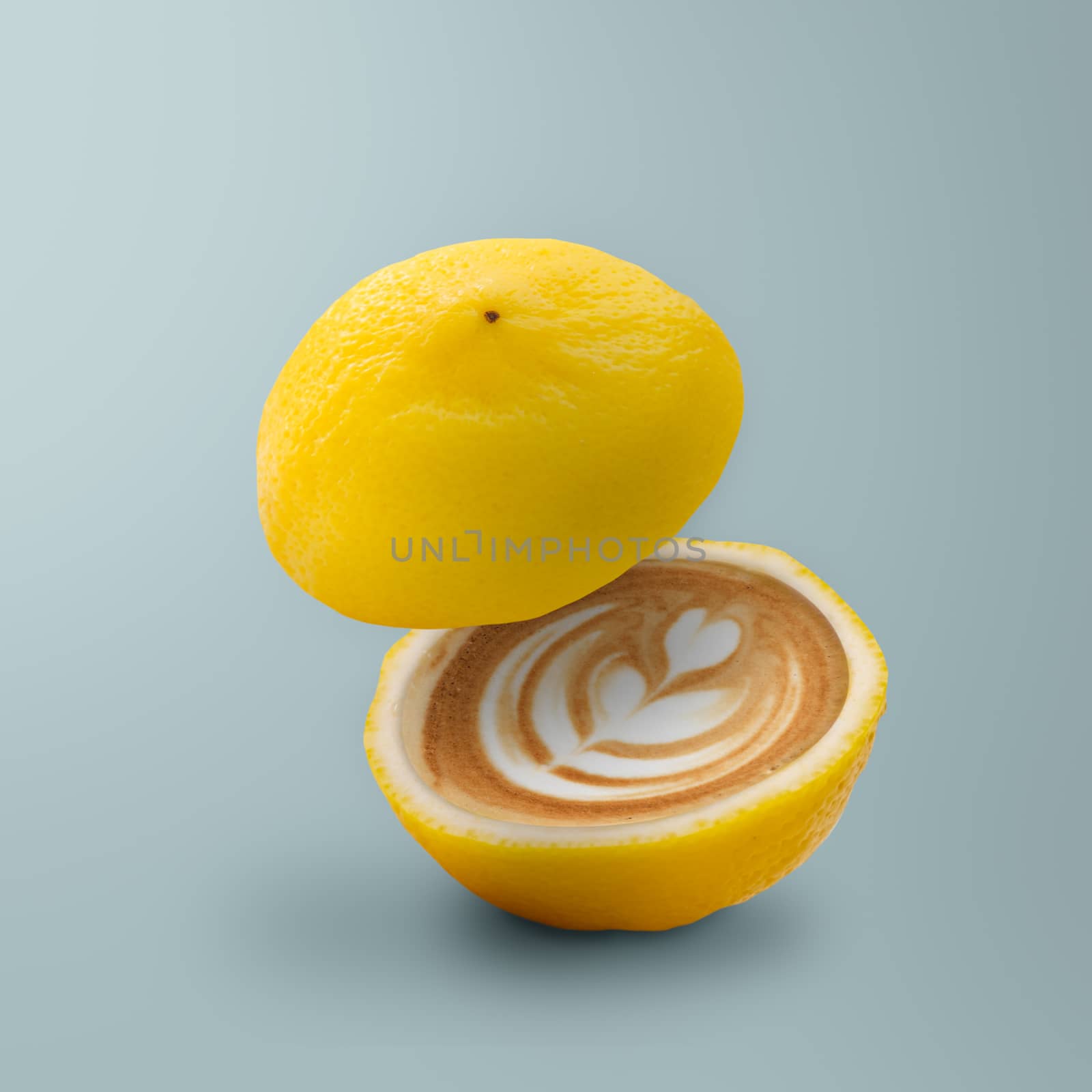 Contemporary art of Lemon with coffee inside on blue background, minimal style. Idea concept of fruit.