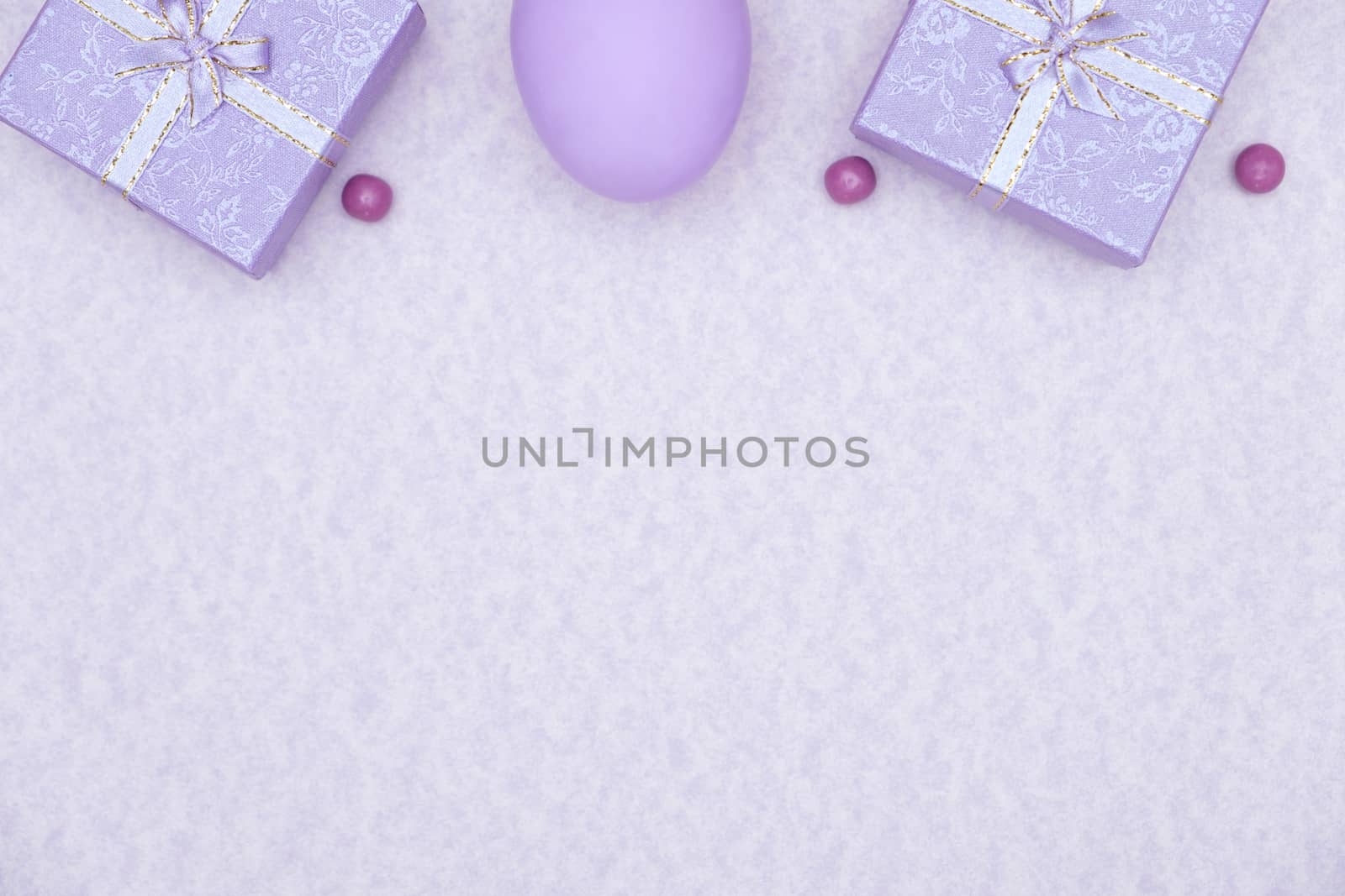 Egg shell on purple background. Minimal and easter concept, with copy space to write.