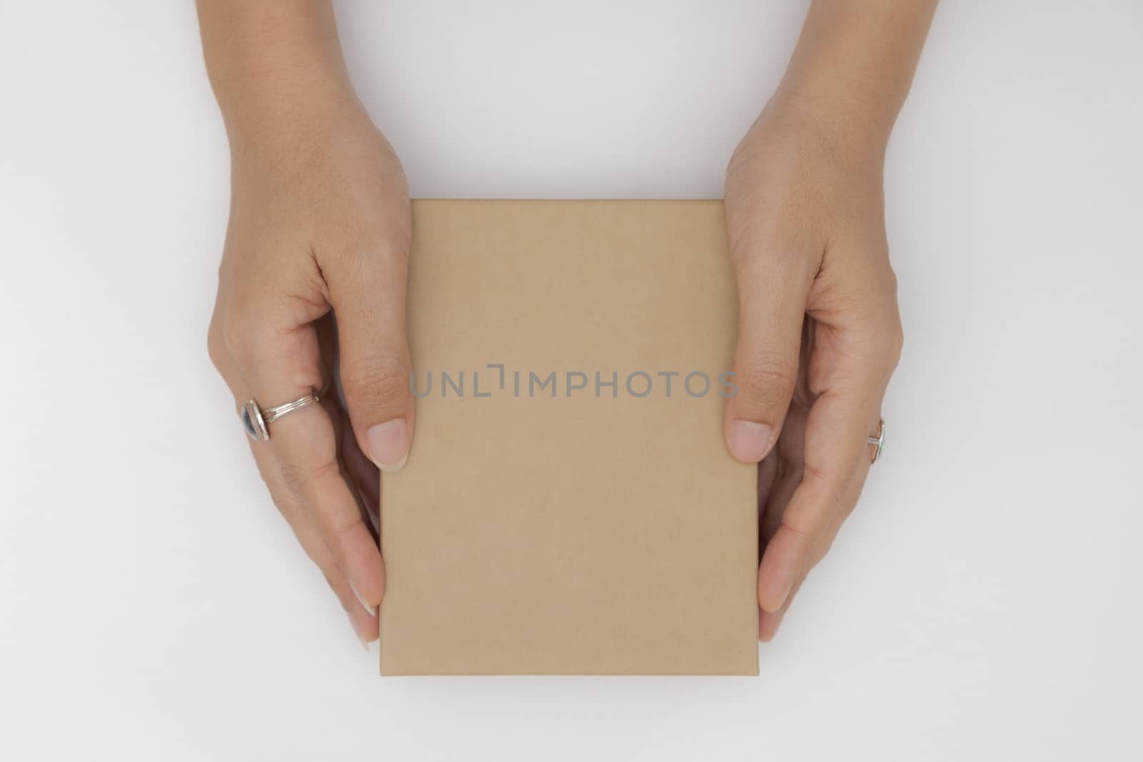 Top view two hands holding and open the empty gift box isolated white background.