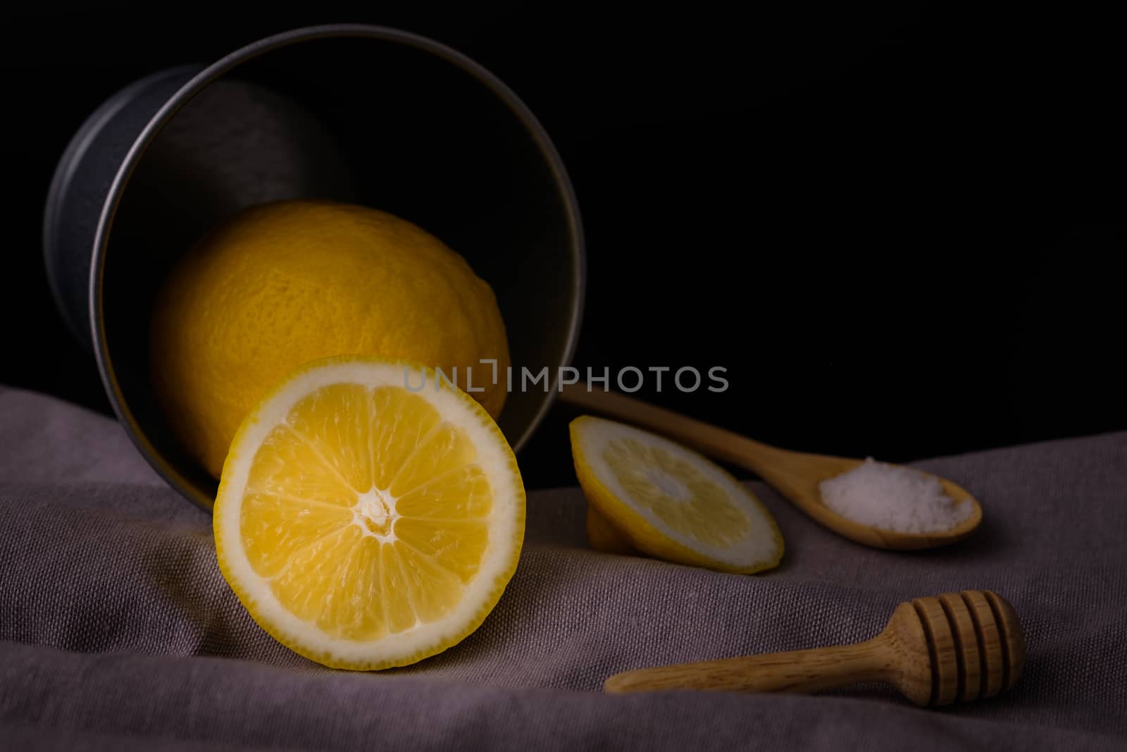 Still life with lemons on black background, Choose focal point, dark light style.