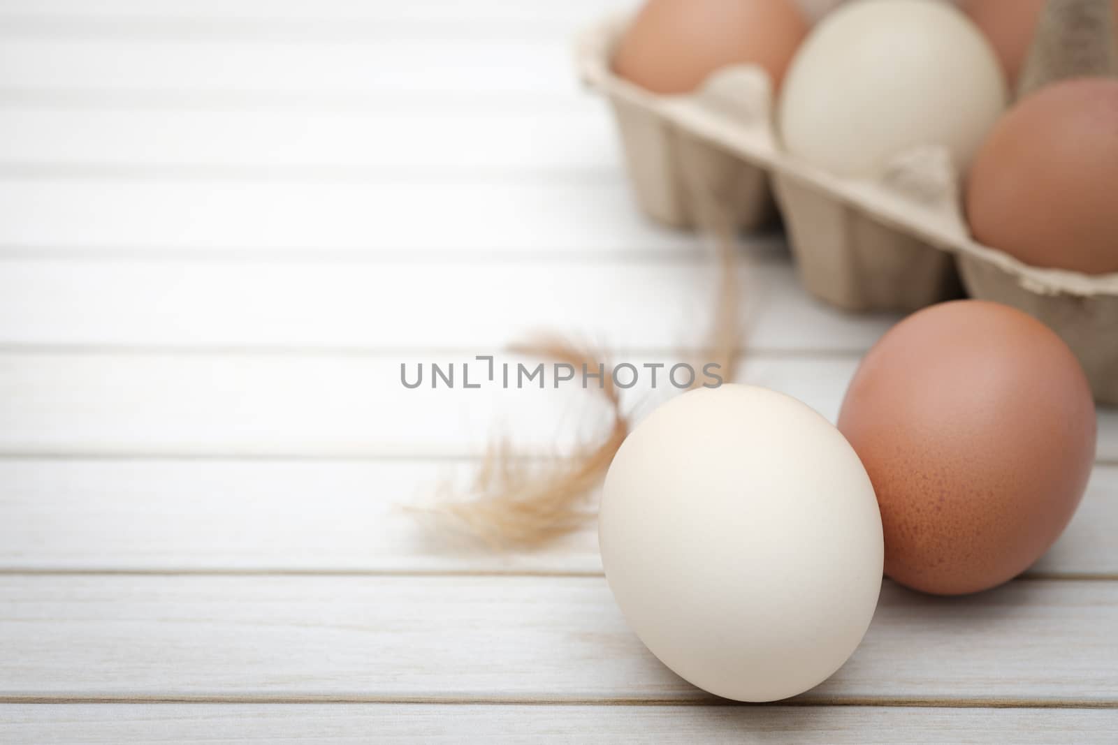 Still life-Eggs on caton box arranged in a white rustick scene, Egg is beneficial to the body, Food concept, with copy space.