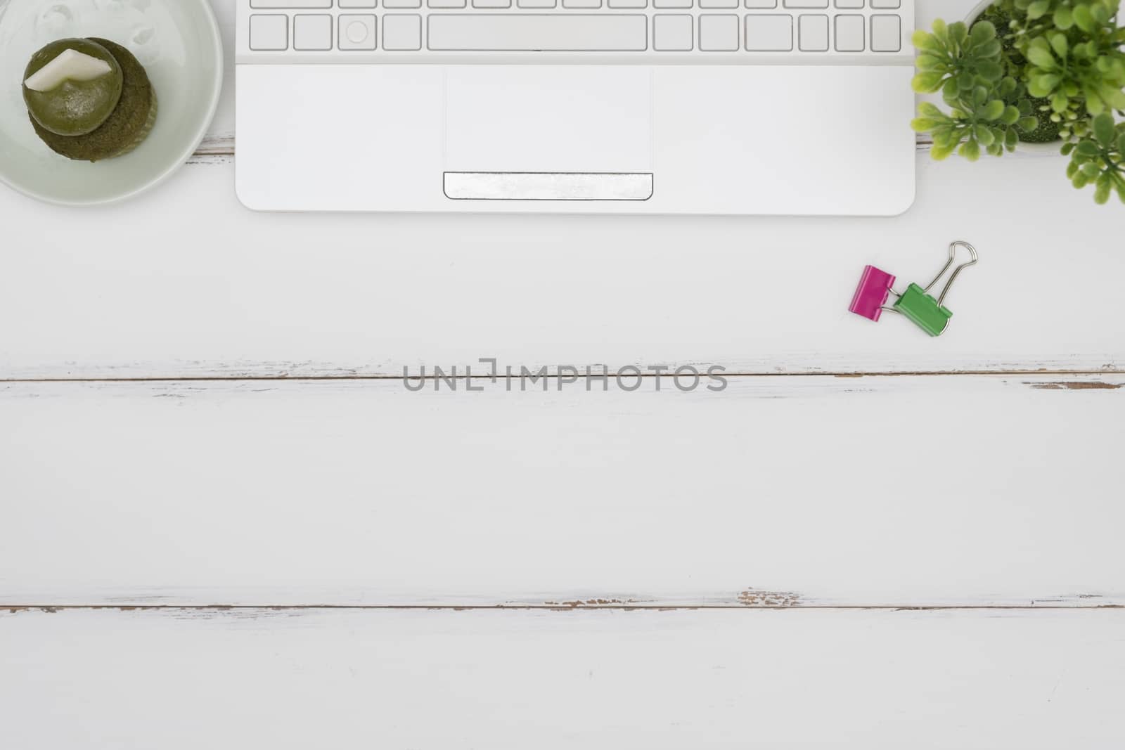 Laptop on white table background, Flat lay style with copy space to write.