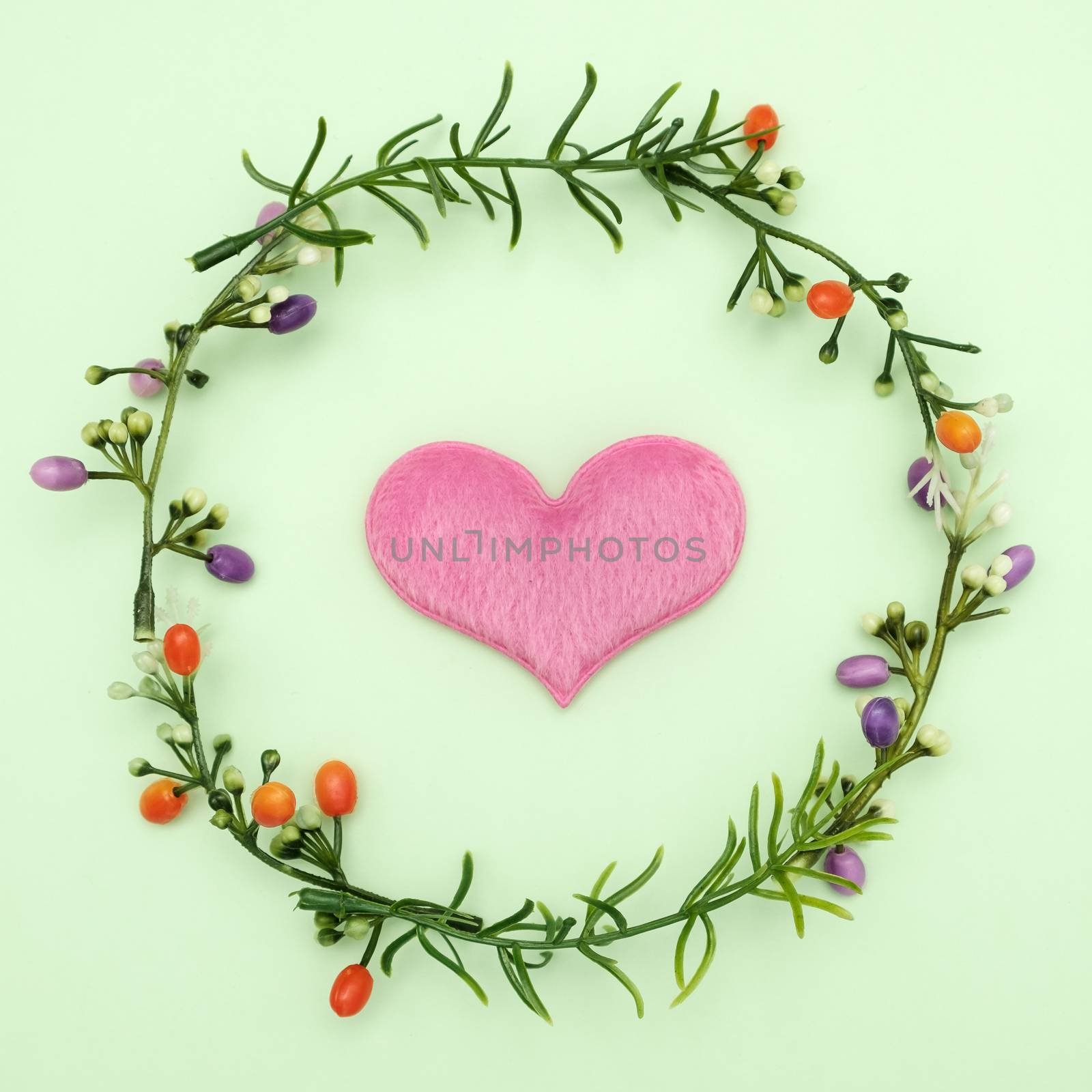 Flowers surrounded the Heart on green background, valentine concept.