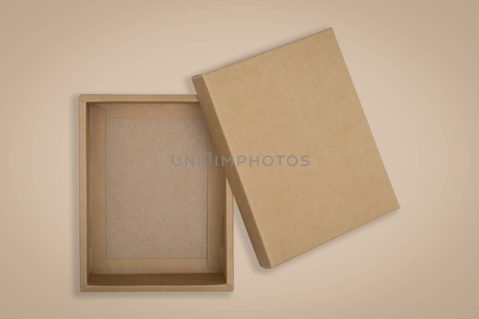 Opened cardboard box on a brown background by feelartfeelant