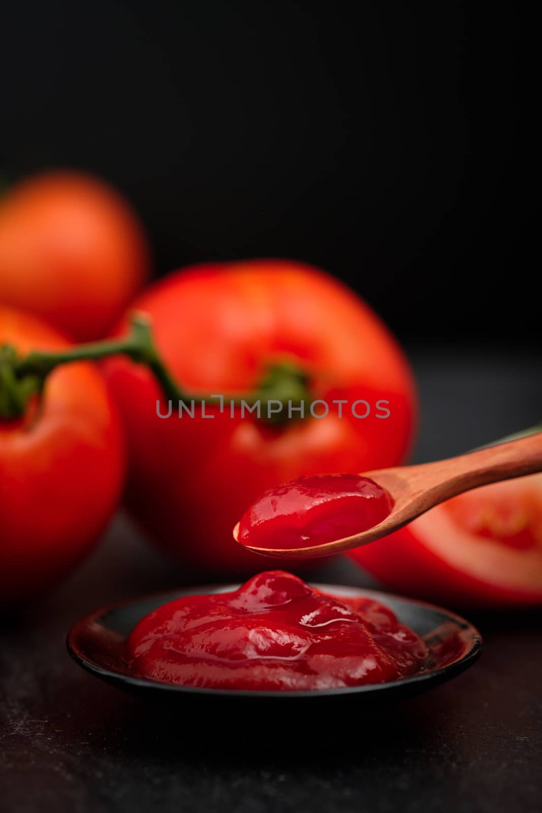 Still life of fresh ripe tomatoes sauce on wooden background,  by feelartfeelant