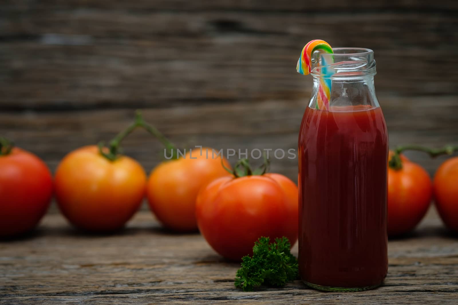 Still life of fresh ripe tomatoes juice on wooden background, Choose focus point. Good health concept.