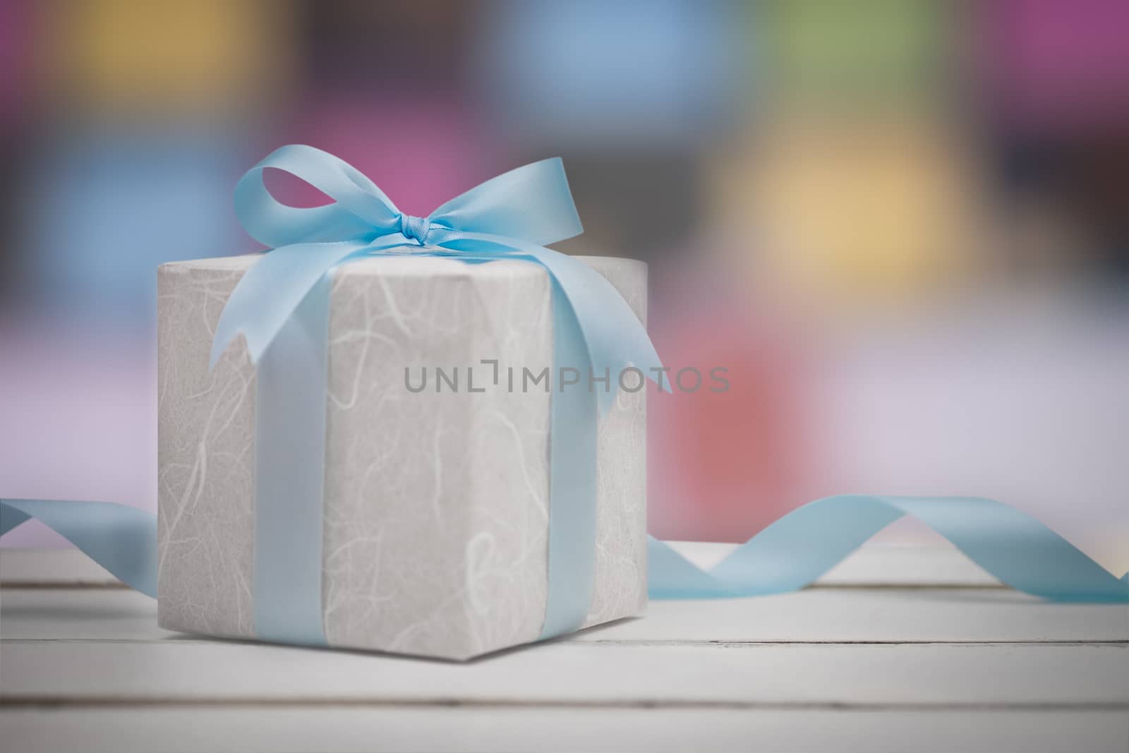 Christmas gift box with bokeh background. New year and xmas Holiday greeting card.