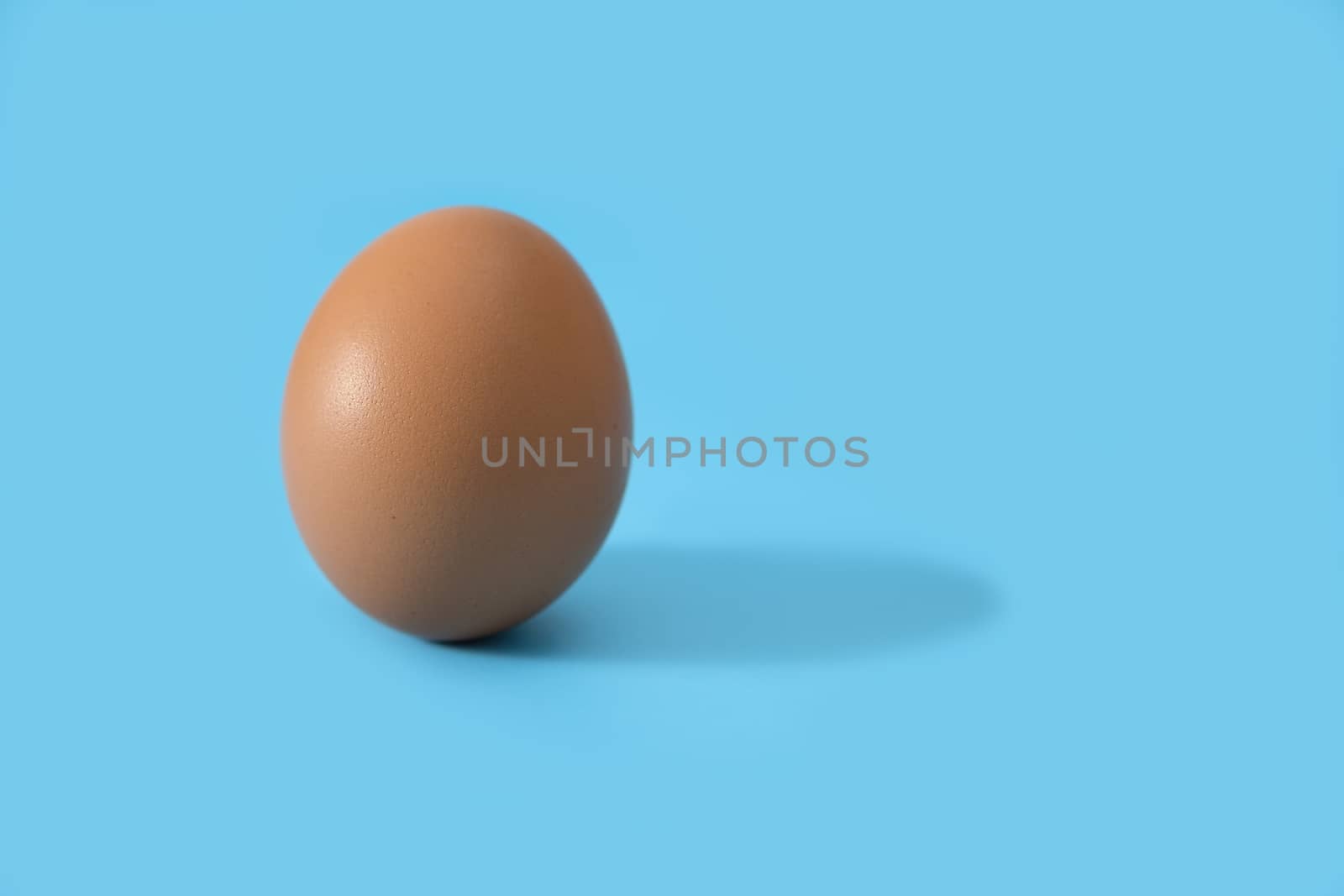 An Eggs isolated on blue background, Eggs is beneficial to the body, Food concept.