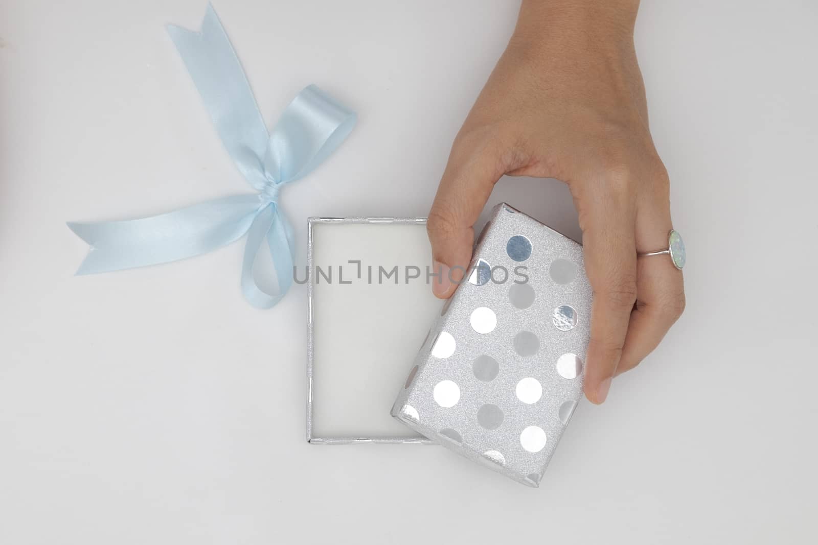 Top view two hands holding and open the empty gift box isolated  by feelartfeelant