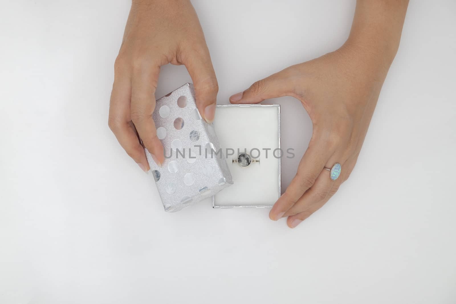 Top view two hands holding and open the empty gift box isolated white background.