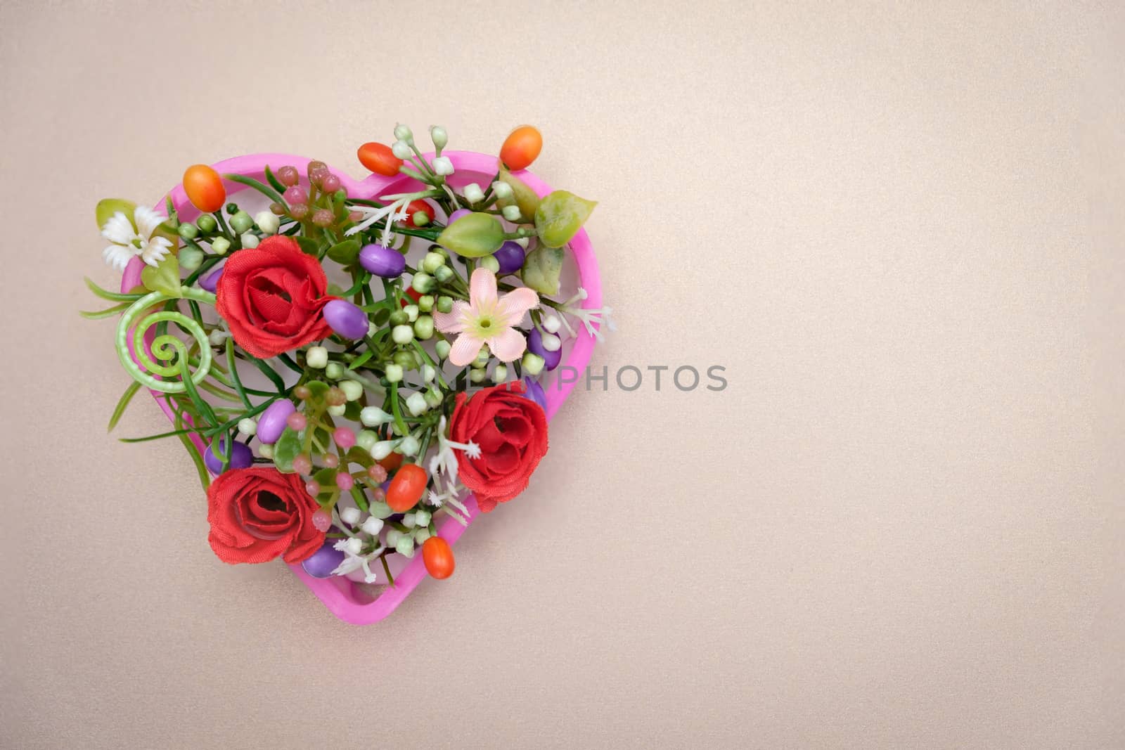 The flowers are in a heart shaped pot, valentine concept.