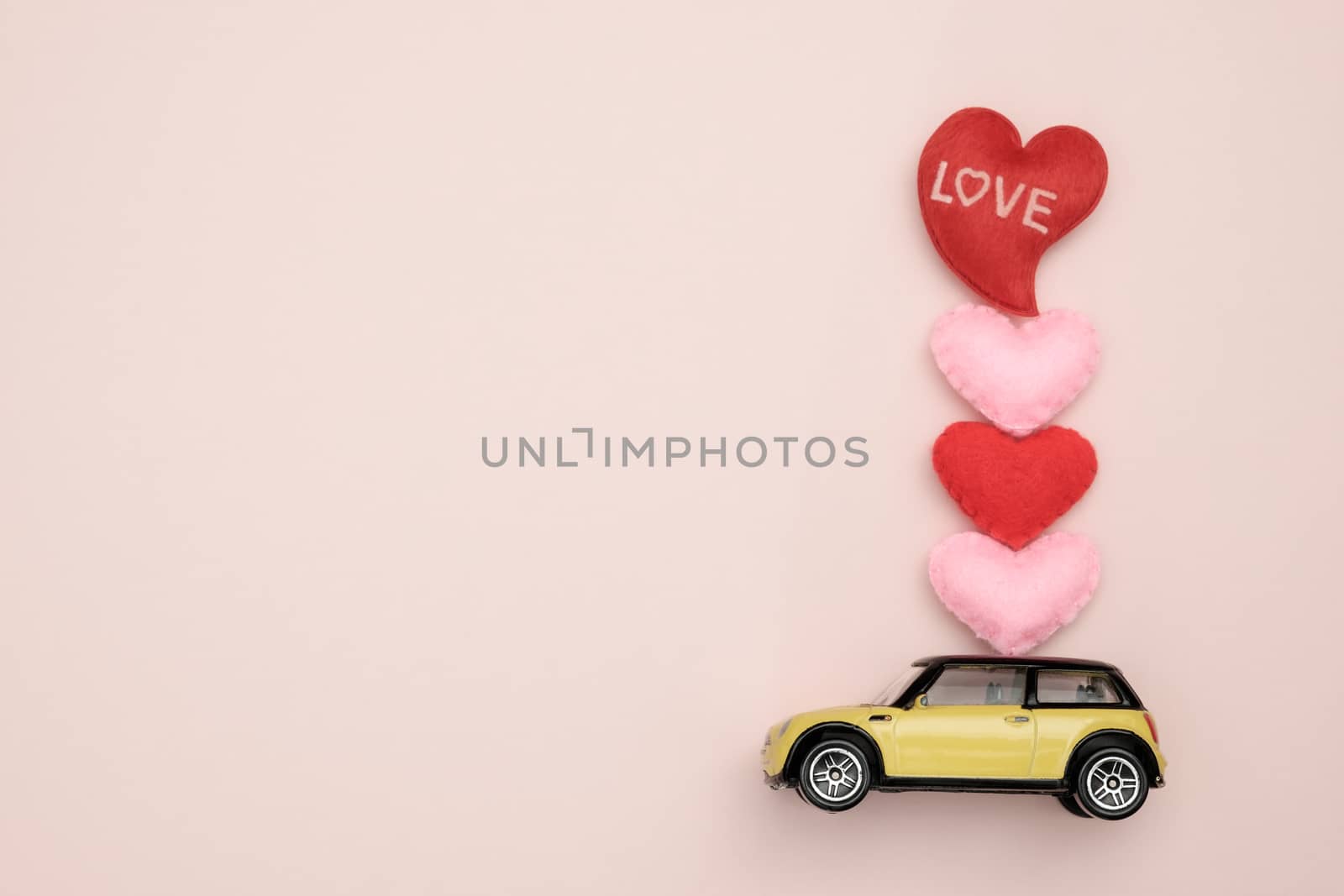 Toy car carrying heart-shape, Concept of valentine day, AF point selection.