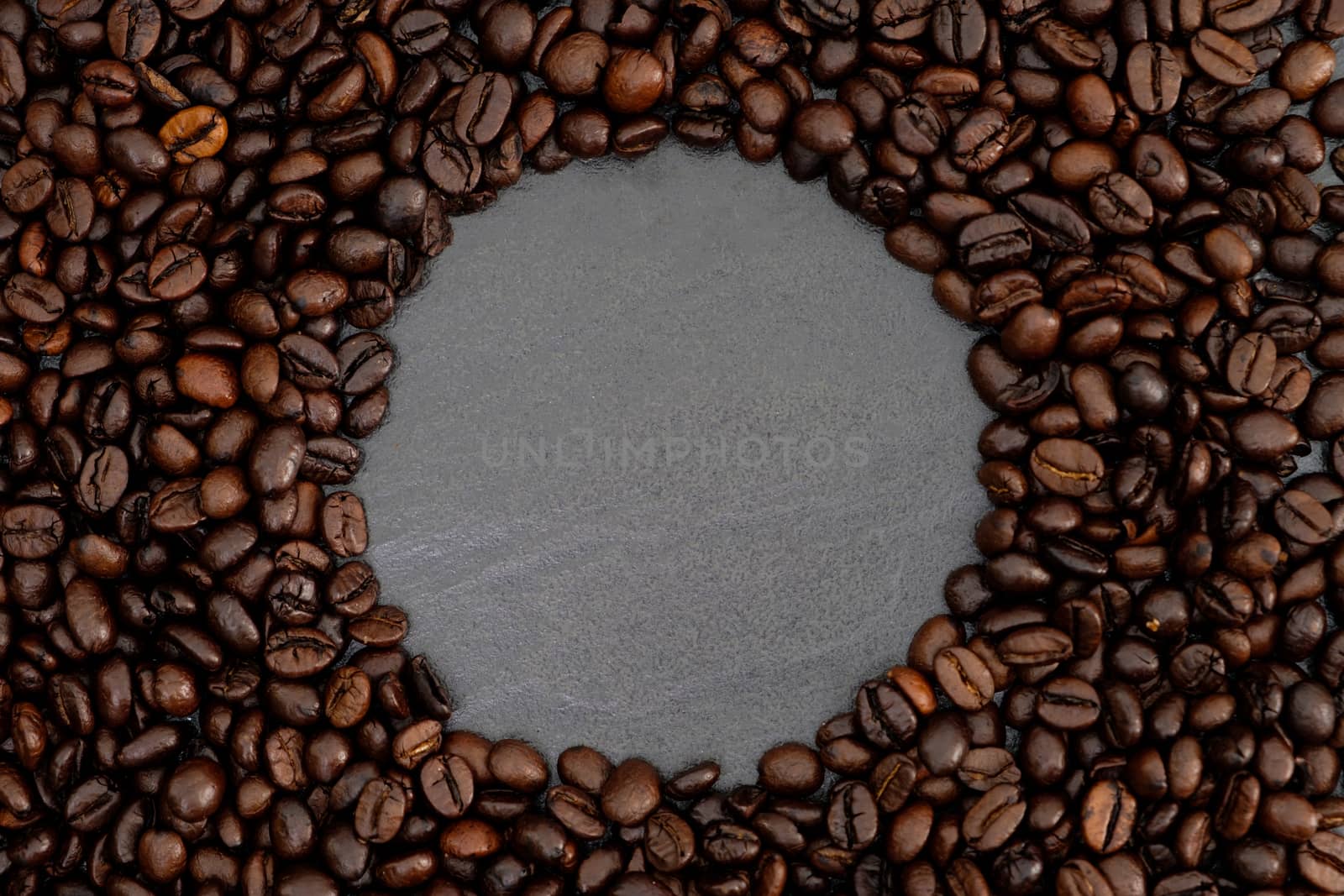 roasted coffee beans background with copy space.