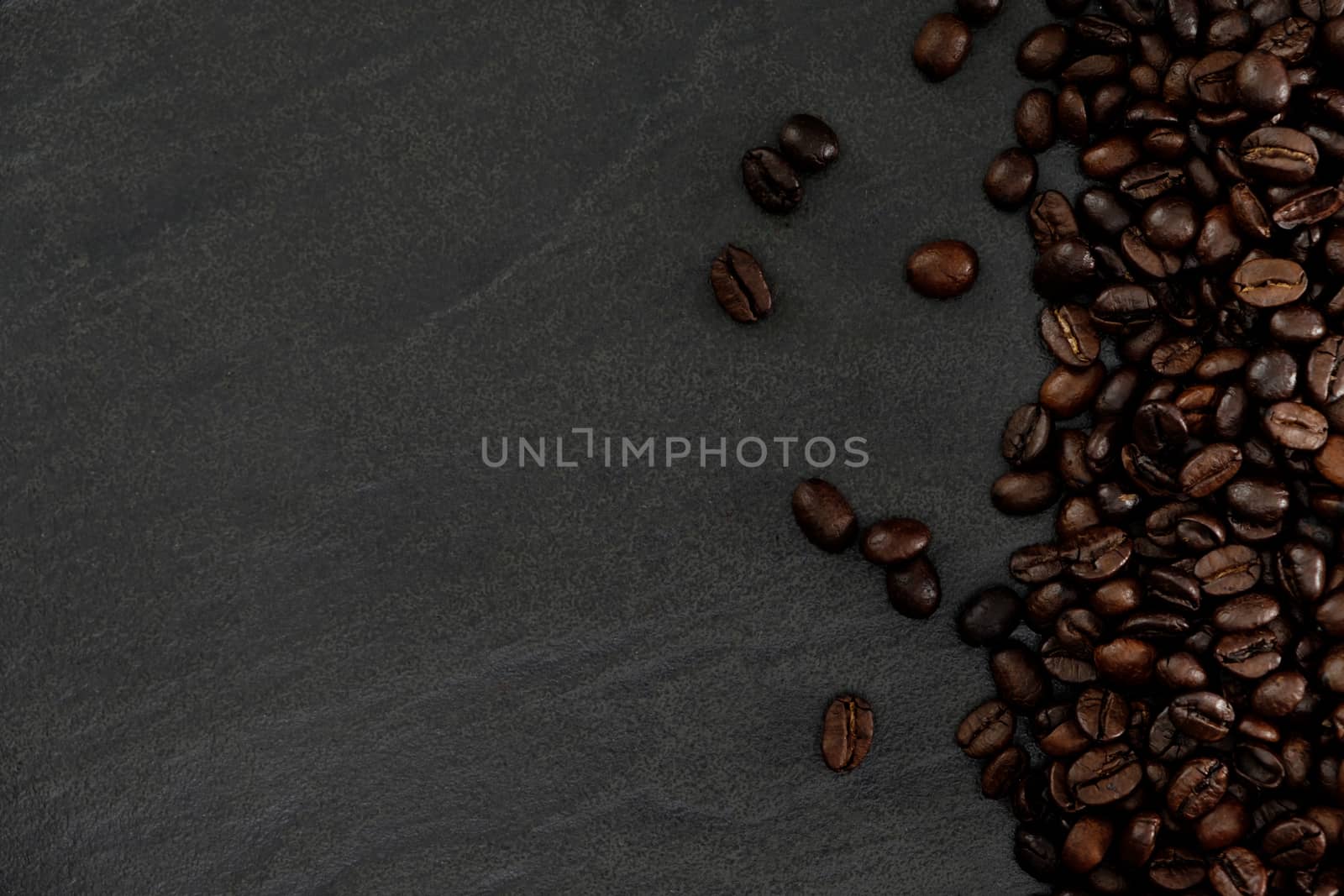 roasted coffee beans background with copy space.