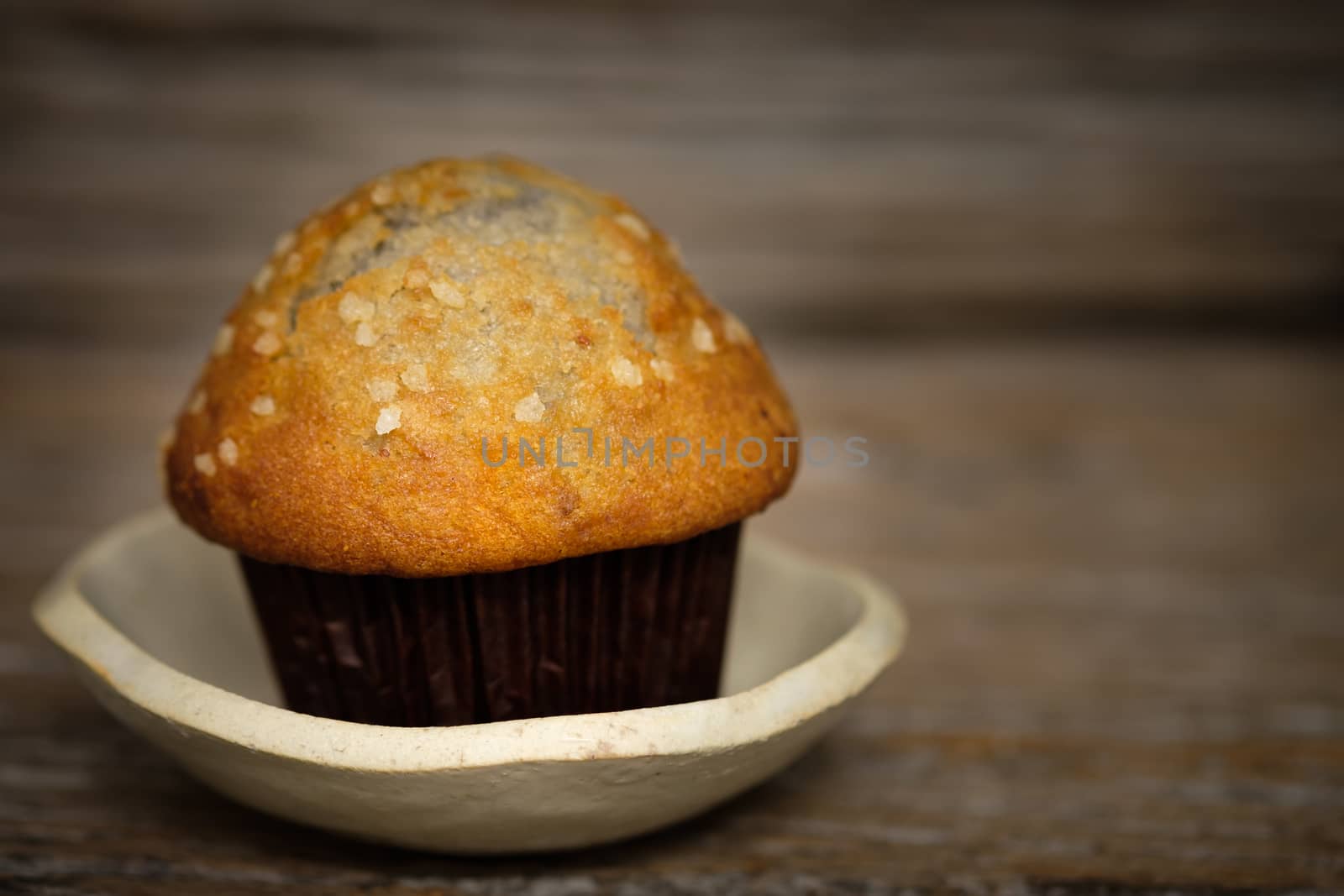 Still life blueberry muffins in a rustic style. Select the focus point.