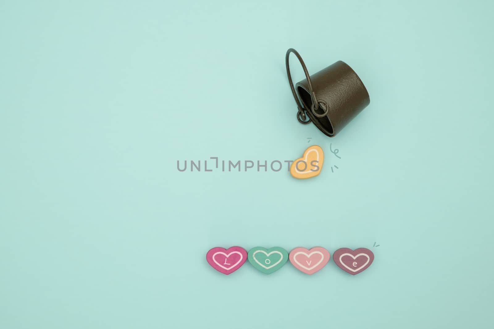 Water tang and heart shape studs on blue background, valentine concept.