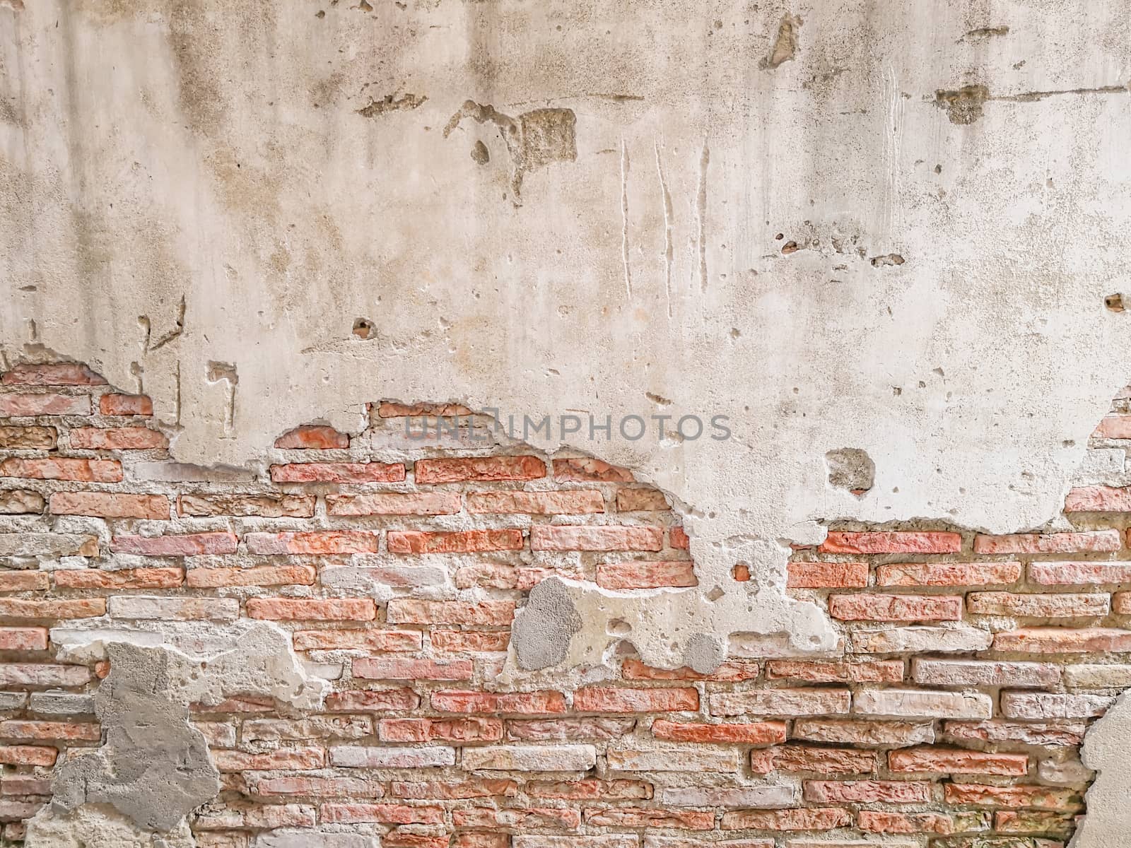 Old brick wall in antiquity and was damaged by the time until the mortar fell. - Image