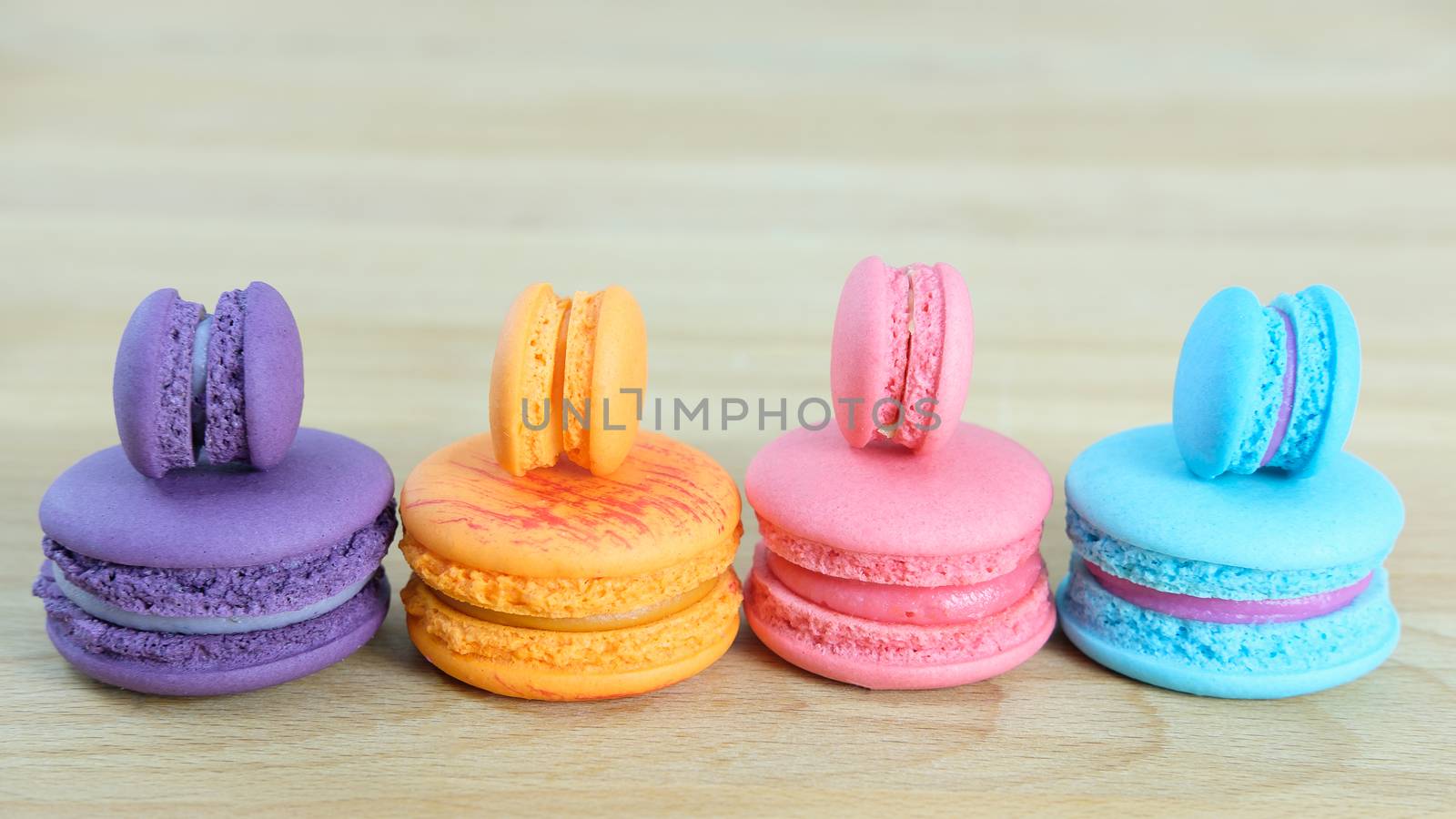 Sweet and colorful, Different kinds of macaroons on light wooden background with blank space,selective focus, Dessert.